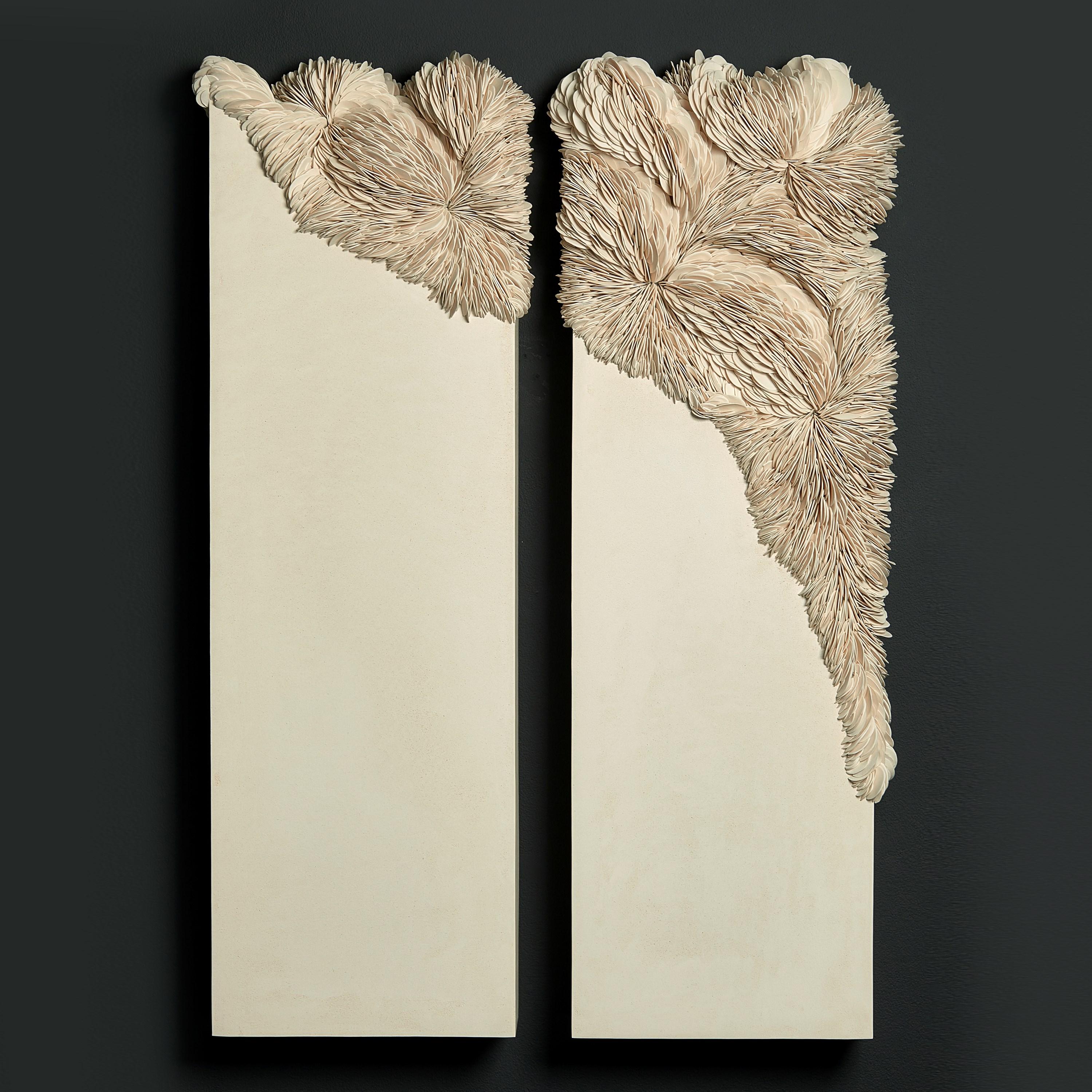 'Collapsed Diptych in Sand' is a unique wall-mounted sculptural artwork by the British artist, Olivia Walker. It has been created from coloured porcelain, tadelakt plaster and resin. The dimensions above are for the two panels.

Each section within