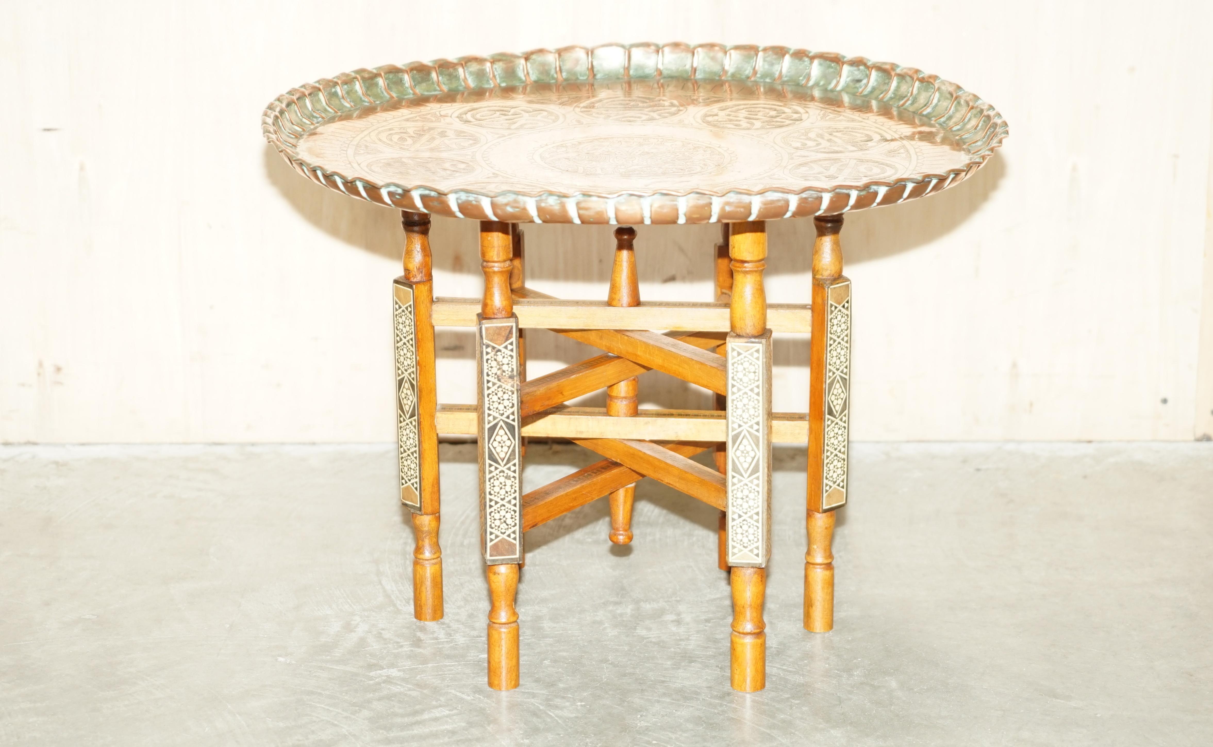 We are delighted to offer for sale this circa very rare 1920 Antique Persian Moroccan engraved brass top folding table.

A very good looking and well-made table, the top is beautifully engraved by hand, the legs are ornately inlaid with very