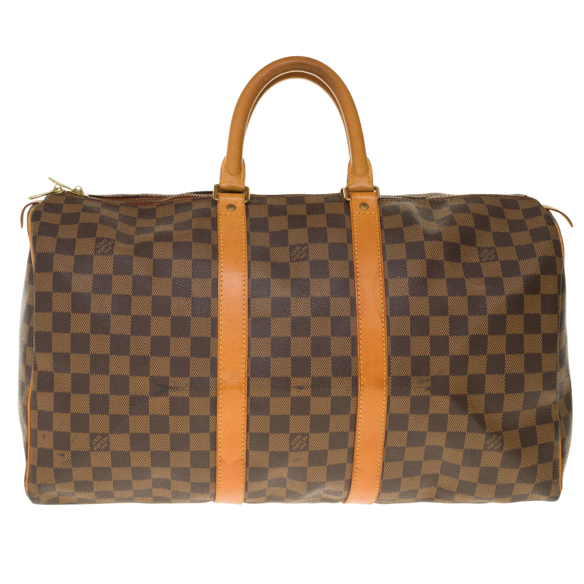 Beautiful Louis Vuitton Keepall Collector travel bag 45 cm in Monogram canvas released on the occasion of the Centenary of the Louis Vuitton brand combining ebony checkered canvas with natural leather (instead of the brown leather used