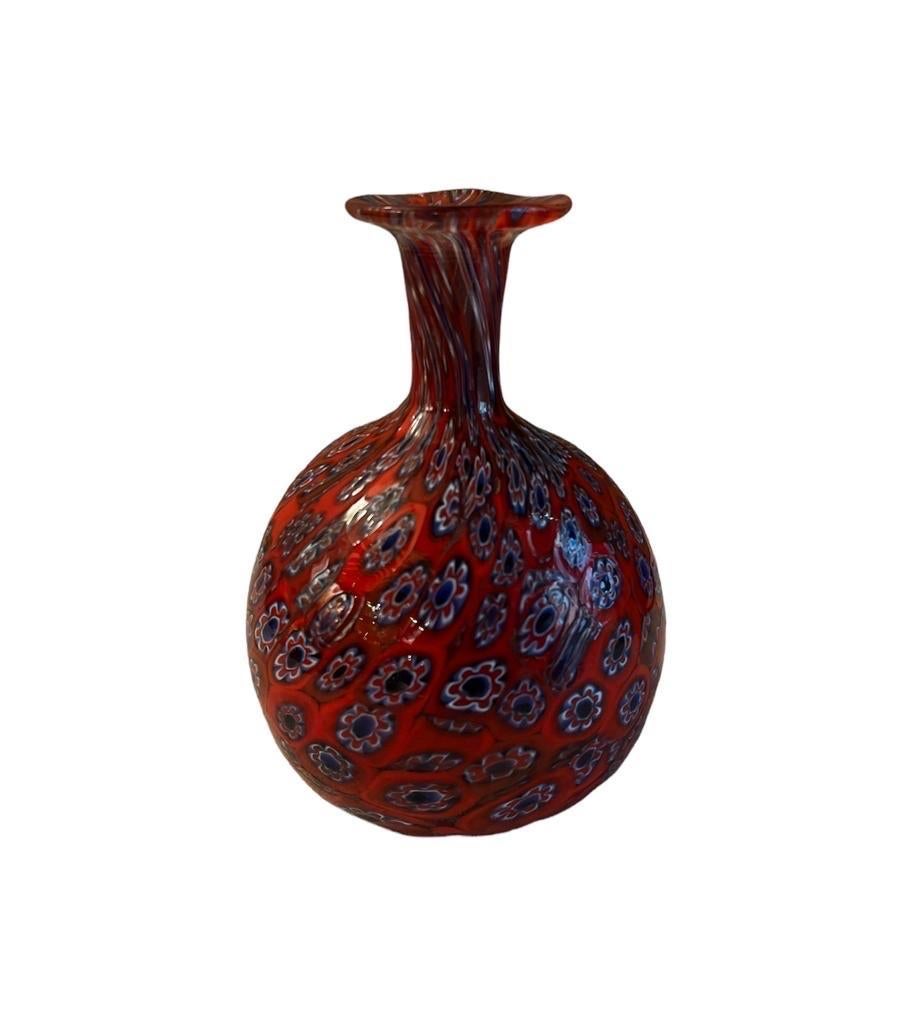 Red rubis vintage Fratelli Toso Murano Murrine Millefiori. Murrine is an ancestral technique in Murano glass. Each piece of Murano glass is handmade, not mass-produced or industrialized. 
It takes a lot of patience and know-how to make Murrine. The