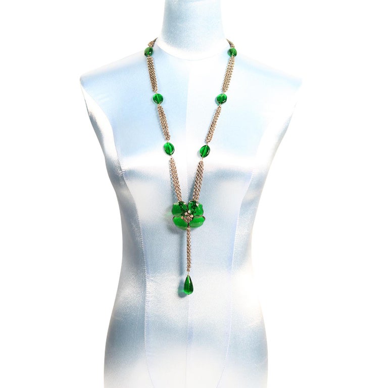 Collectible Augustine Silver Tone Necklace with Green Gripoix Flower and Pieces. Long Sautoir with Flower at End and dangling  Green Gripoix Piece.
Gripoix is always classic and always a work of art.
Augustine is the son of Thierry