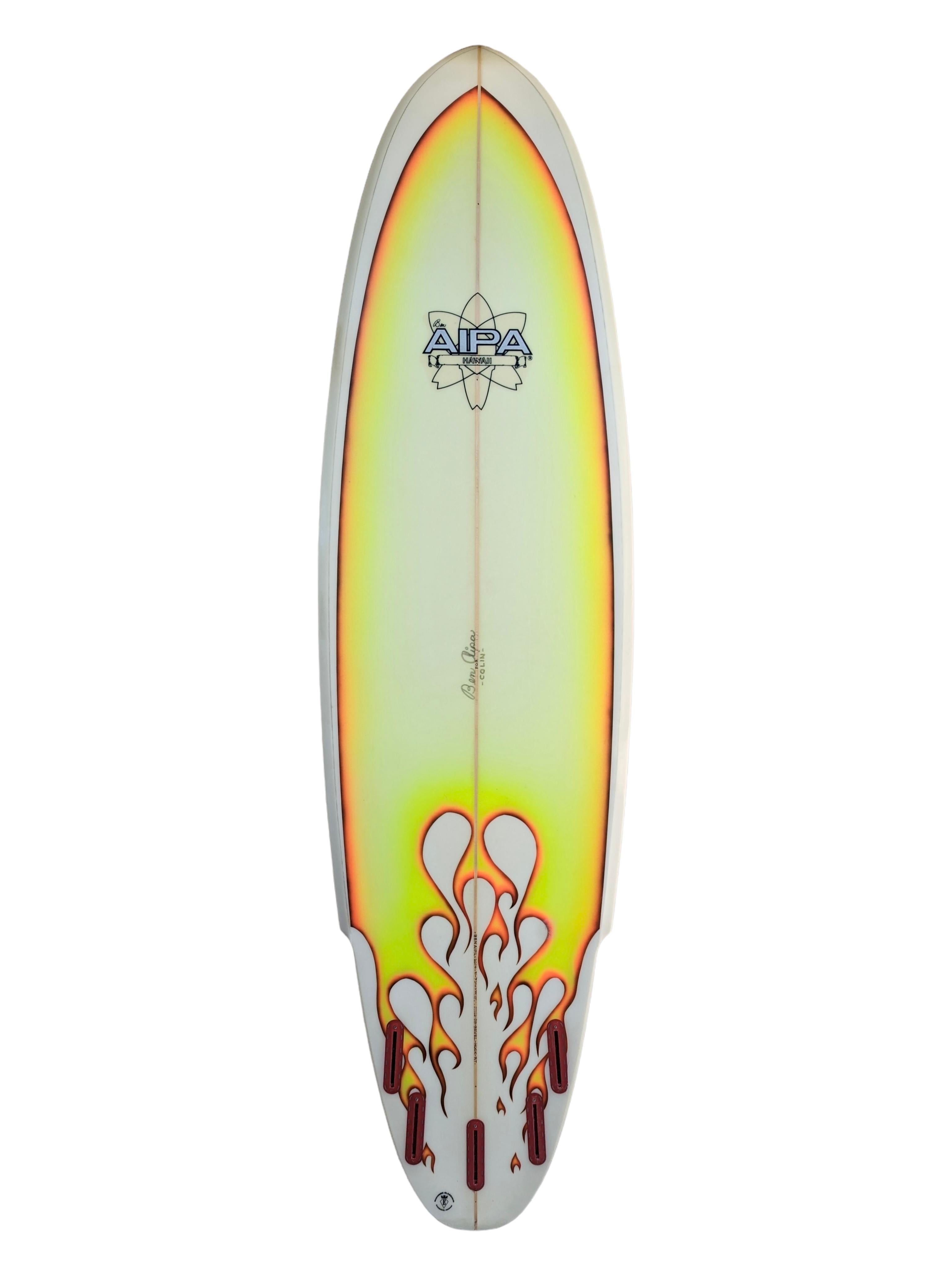 Collectible Aipa Hawaii Sting surfboard shaped by the late Ben Aipa (1942-2021). Features the famous ‘Sting’ winged surfboard design which Aipa invented. Airbrushed work of art featuring flames top/bottom. 5 fin boxes allowing for both quad fin and