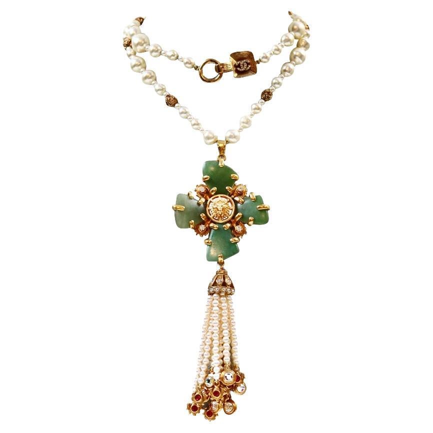 Collectible Chanel Couture Pearl with Green Cross and Dangling Pearls Circa 2005.  One of the most magnificent Chanel pieces I have ever seen.  There are so many elements to the necklace. On top of the green cross there is a lion which has a