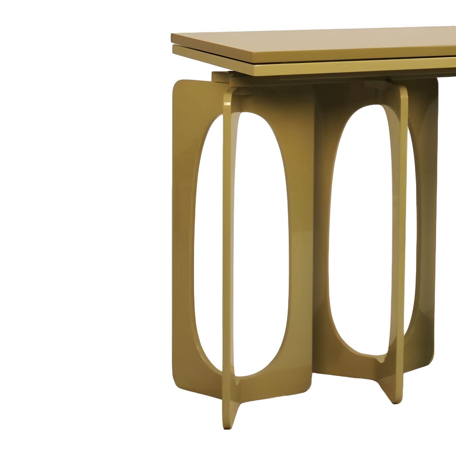 
This elegant and sculptural console table is a study in streamlined design and modern form. The piece features a smooth, rectangular top and a lower top, both finished in lacquer, giving them a clean and reflective quality. The most distinctive