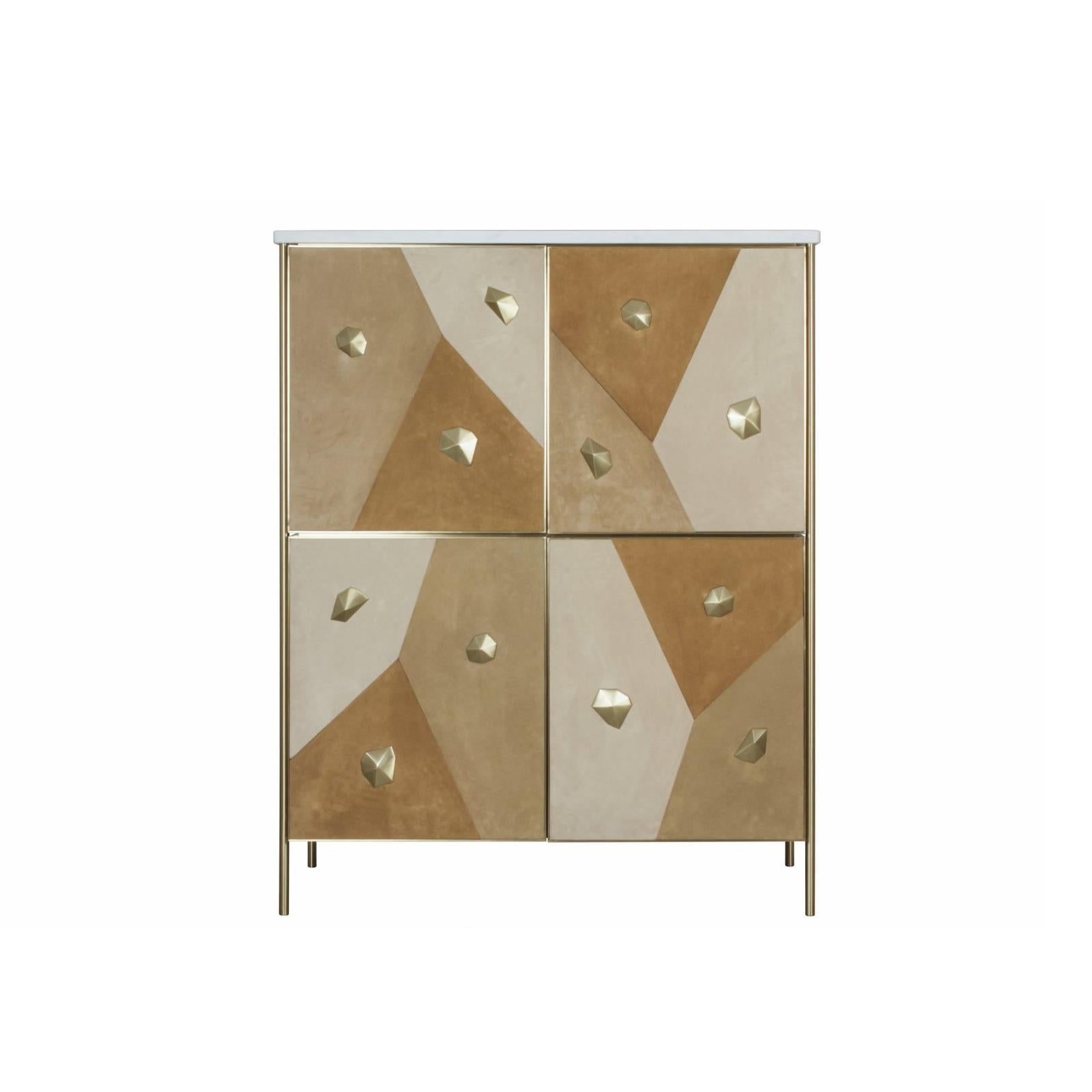 This sophisticated and artistic cabinet is a beautiful composition of contrasting materials and textures. It features a sleek top made from Estremoz marble, known for its elegant white appearance and subtle veining. The cabinet's substantial