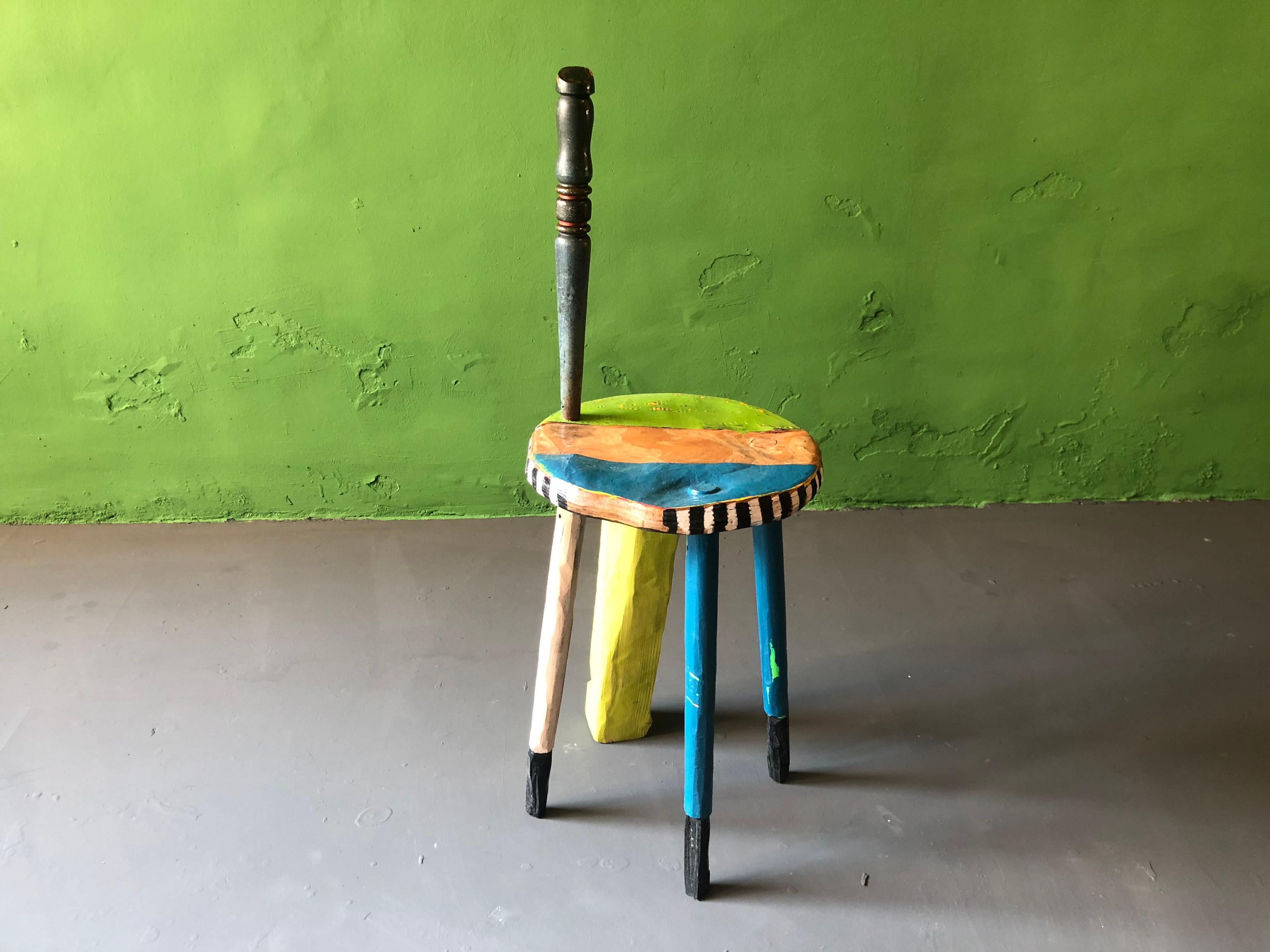 1940's work stool contemporized, additionel sculptural leg, hand grip, painted and multi lacquered.
Through my work I transform each chair into a unique and individual object. Chairs that once were mass-produced and homogenous, become singular and