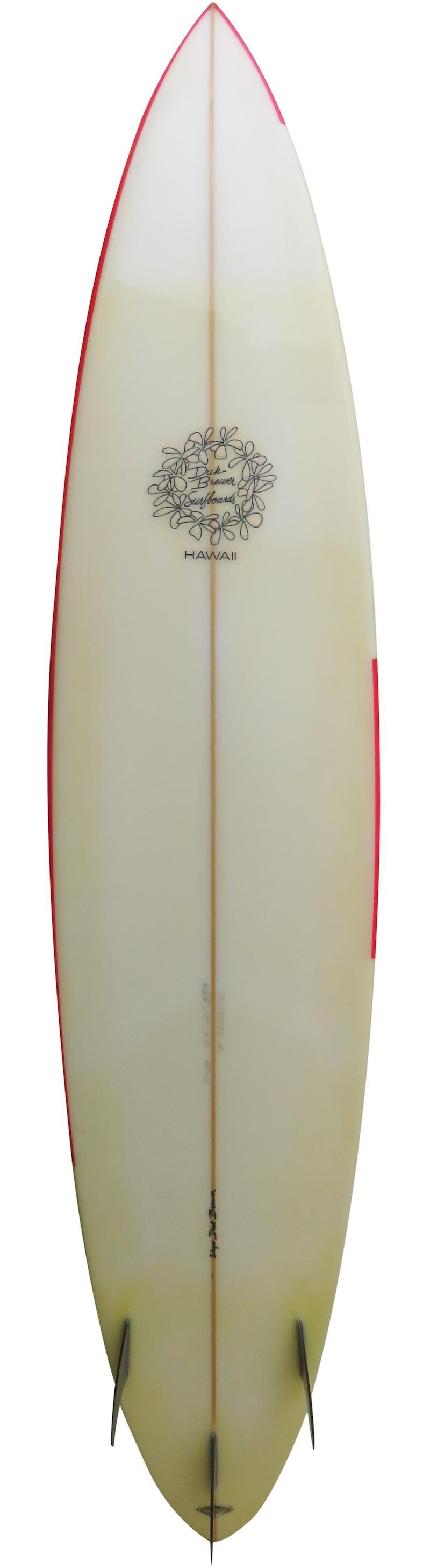 Collectible Dick Brewer shaped big wave gun surfboard. Featuring a red flame airbrush design and glassed on thruster (tri-fin) setup. This surfboard is in all original condition.

Dick Brewer is a world famous pioneer surfboard designer and shaper.