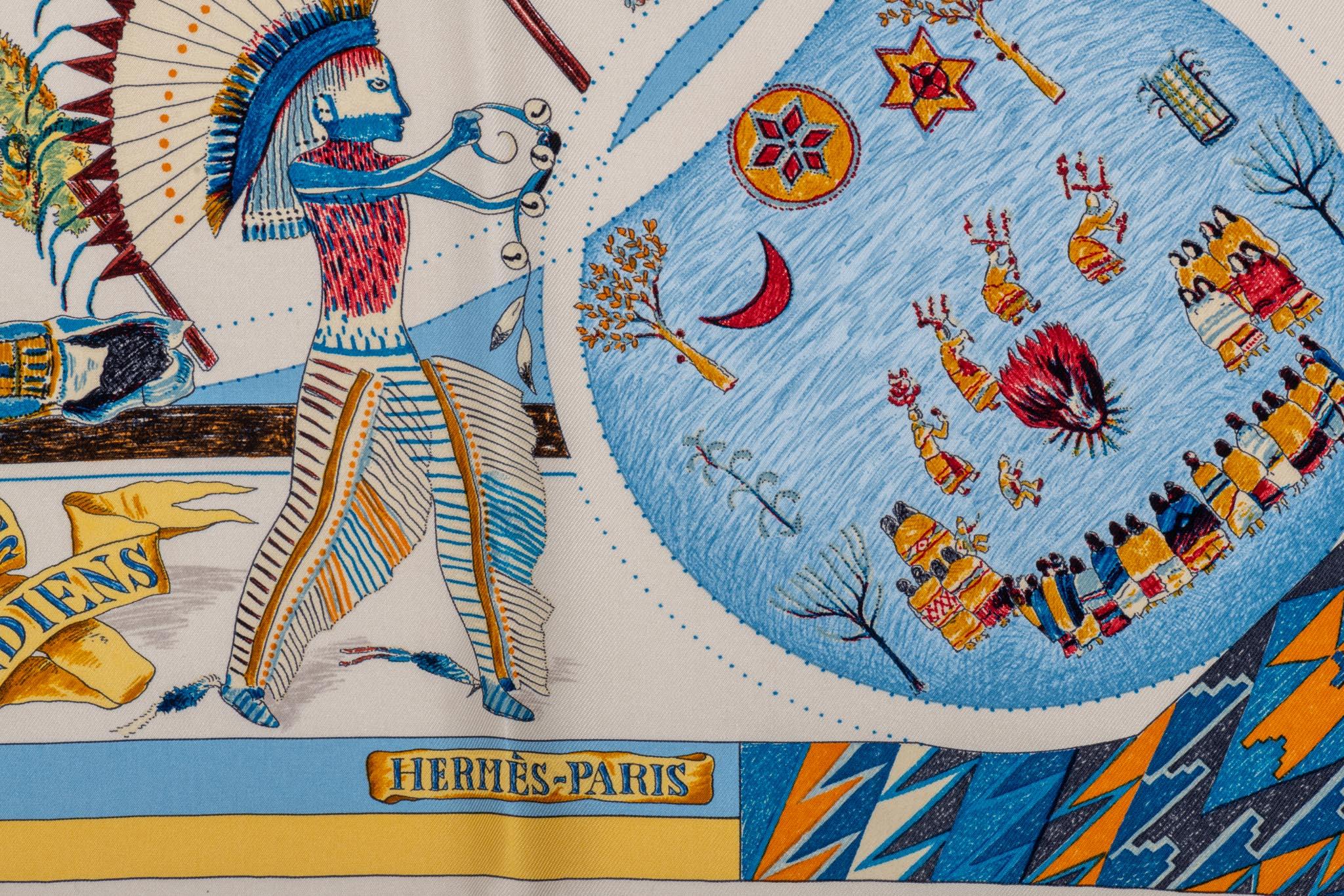 Rare Hermès Les Danses des Indiens silk scarf designed by Kermit Oliver. Hand rolled edges. Highly collectible.