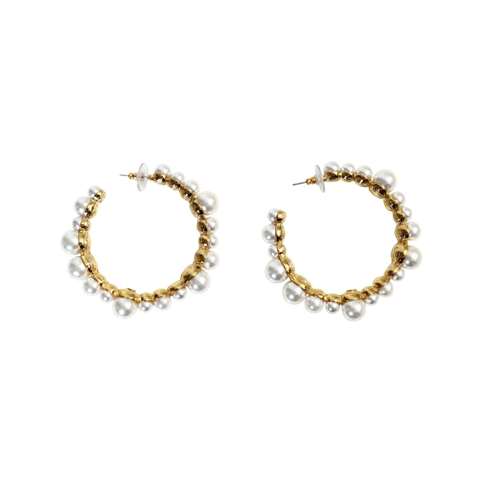 Collectible KJL Gold Hoops with Faux Pearls Circa 2000s. These have quite the look.  Large front facing hoops with Faux pearls in various shapes.  The larger pearls stick forward giving a very chic look.  Perfect for many outfits.  Pierced.

These