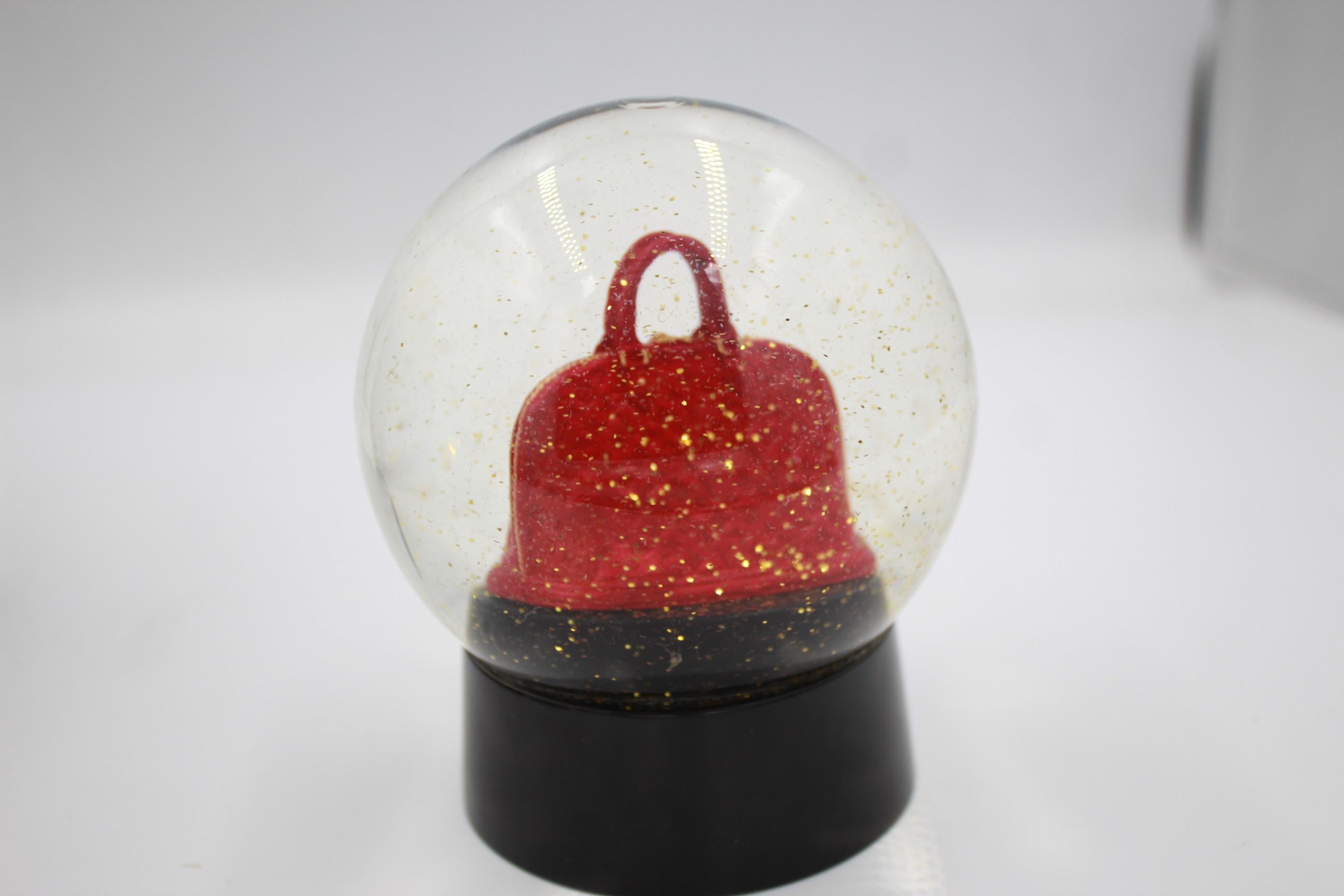 Lousi Vuitton red Alama Snow globe. 
Good condiiton but some scratches in the base. 
Sold with box.