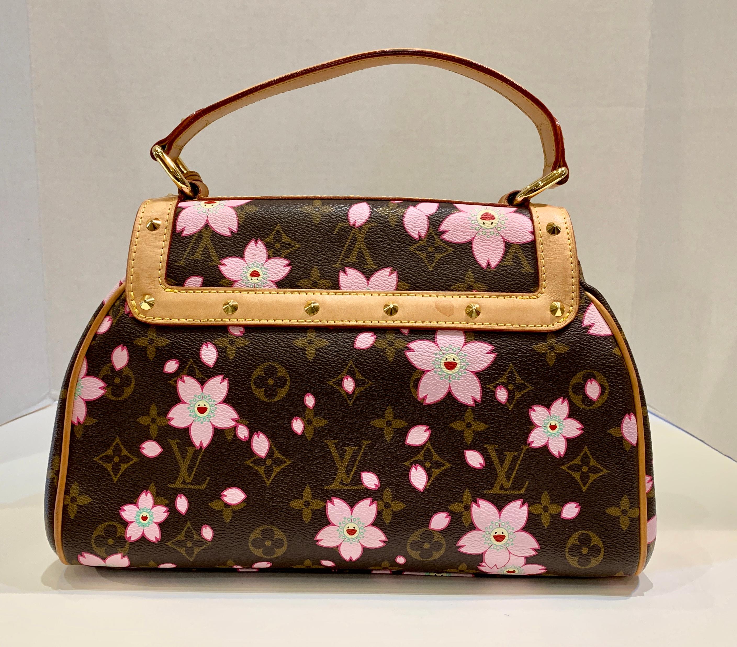 Rare collectible retro Louis Vuitton limited edition Cherry Blossom purse or satchel or handbag from the Spring/Summer 2003 Takashi Murakami Collection is a timeless and feminine bag that Louis Vuitton lovers everywhere want to collect.

Purse has