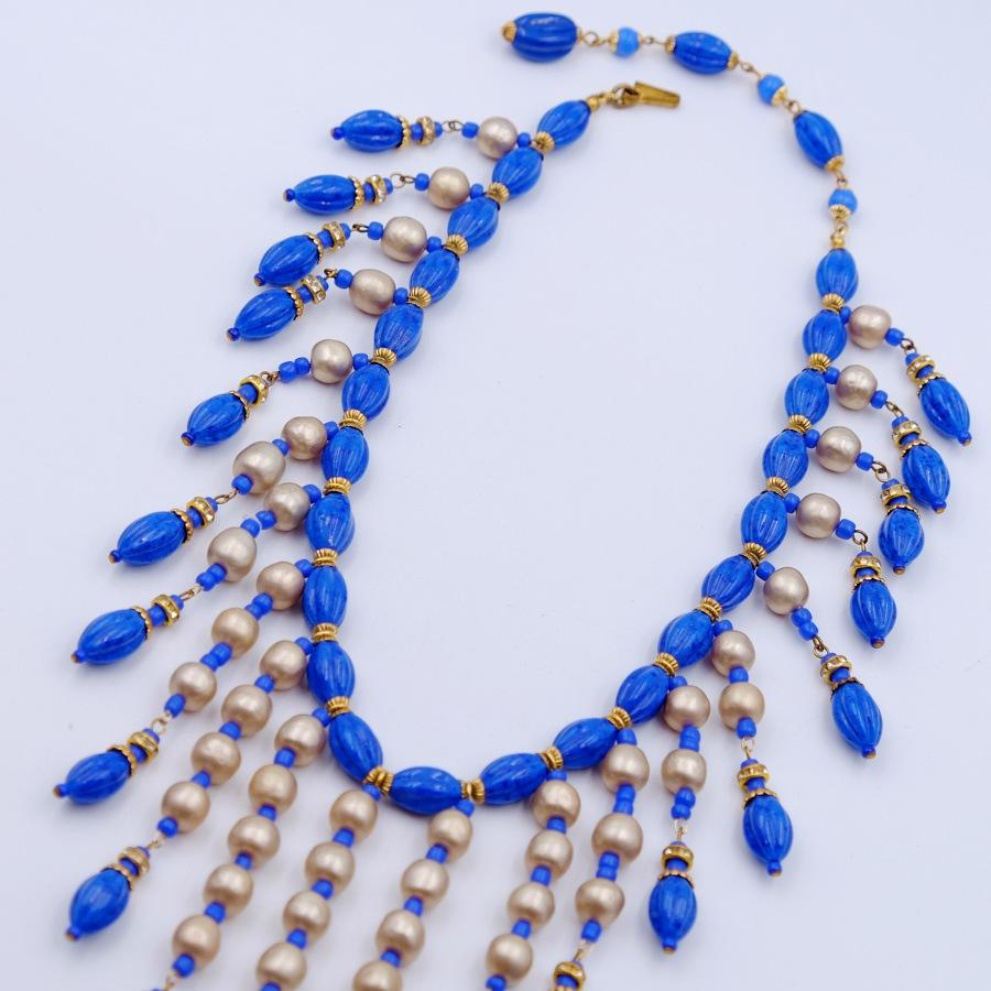 ​​Year: 1949
Hallmark: Miriam Haskell​
Materials: base metal, faux lapis, faux pearls