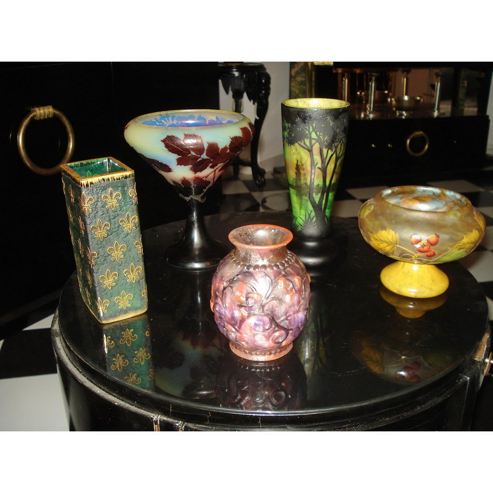A Daum Cameo Glass Vase,
of square form with repeating enameled gilt fleur-de-lis decoration, on a textured green ground, etched Daum Nancy with the Cross of Lorraine. A museum piece in an incredible state of preservation! 
Height 18.7 cm (7.36in).