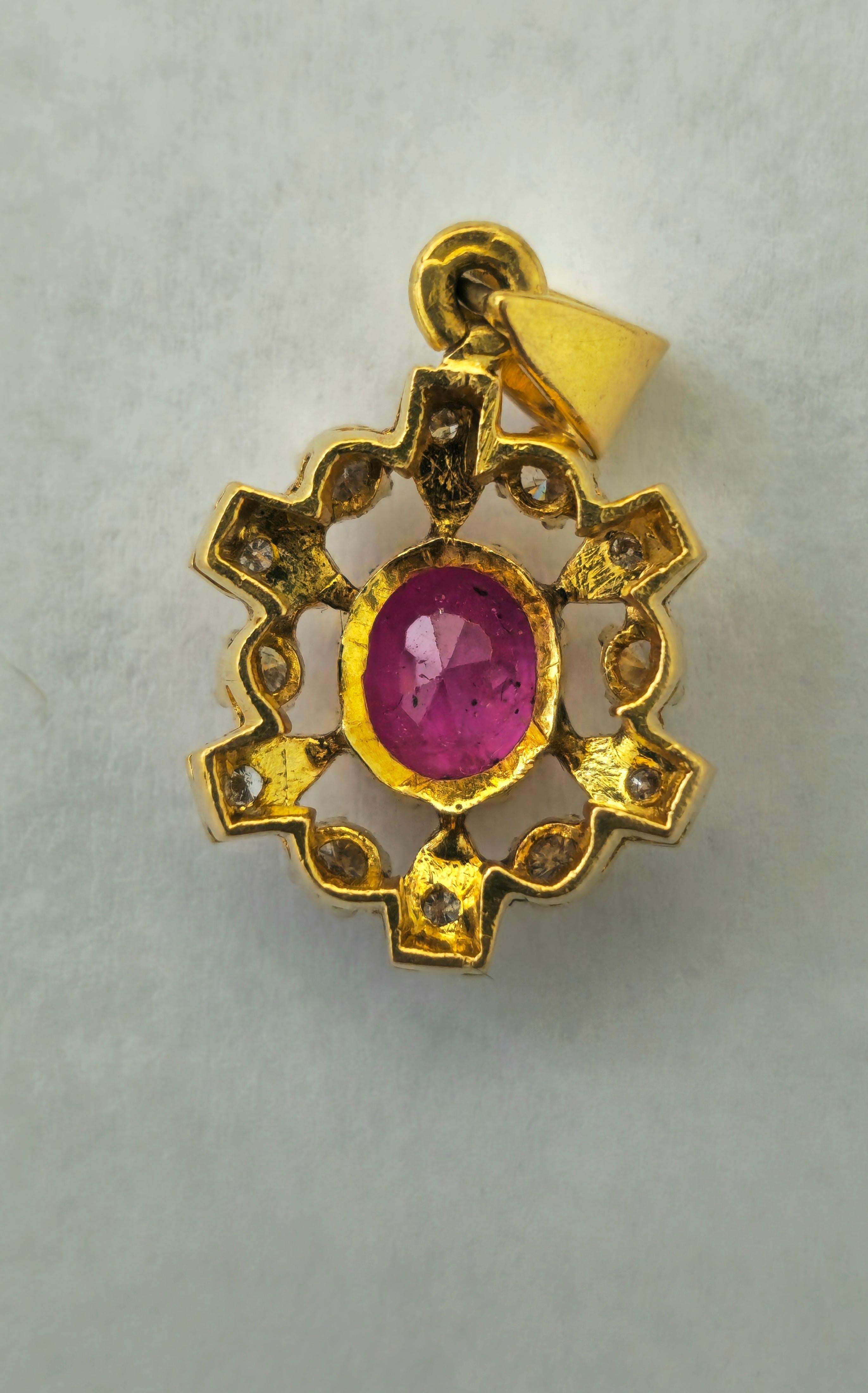 Elevate your style with this exquisite 18k yellow gold pendant featuring a stunning 1.06 carat natural ruby in an elegant oval shape. The ruby boasts good color and saturation, radiating beauty and sophistication. Surrounding the center stone are