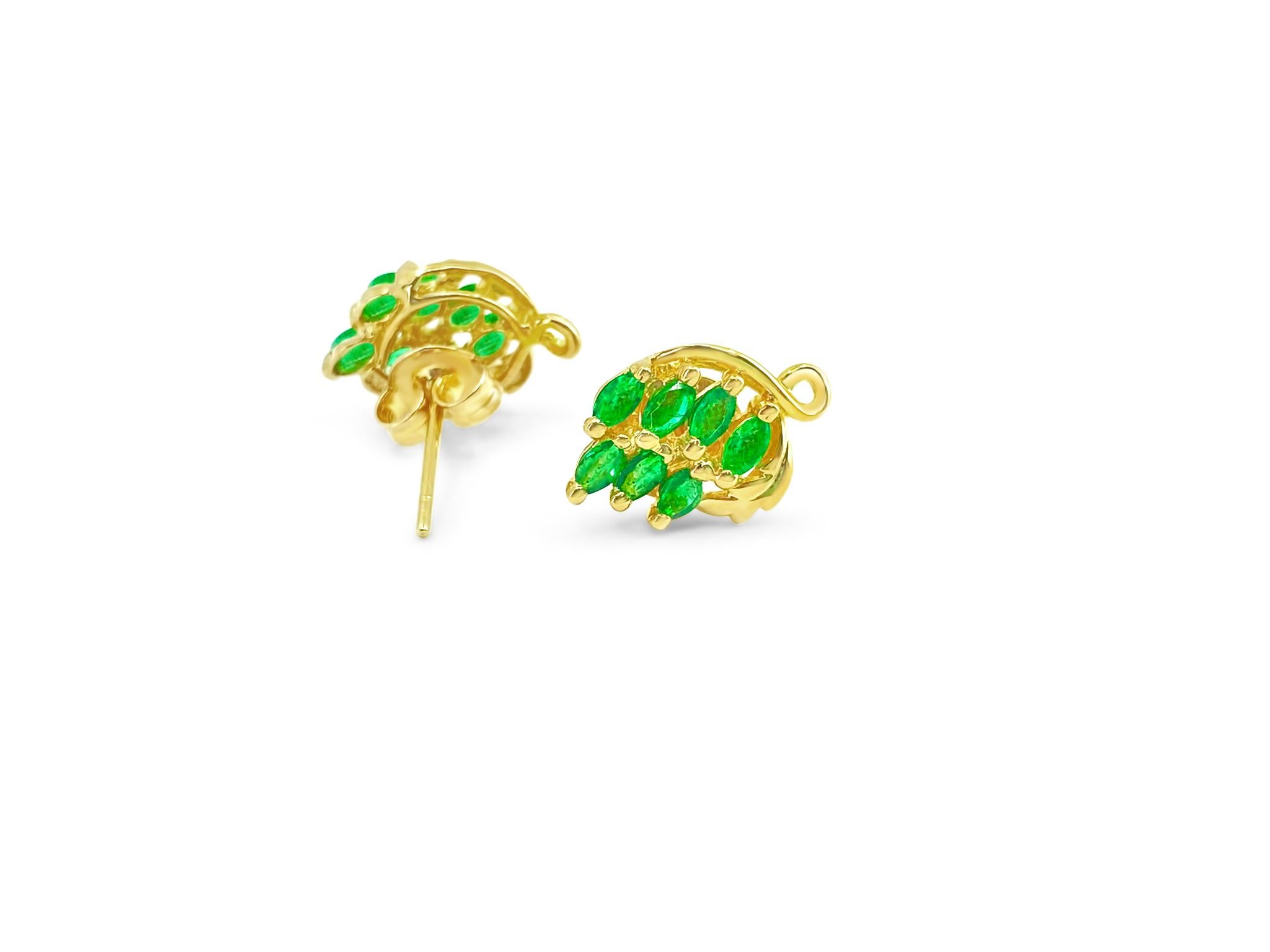 Fashioned from 14k yellow gold, these vintage stud earrings boast a total of 2.25 carats of marquise-shaped, natural earth-mined emeralds. Weighing 1.82 grams, these collectible earrings feature a timeless design and come with butterfly pushbacks