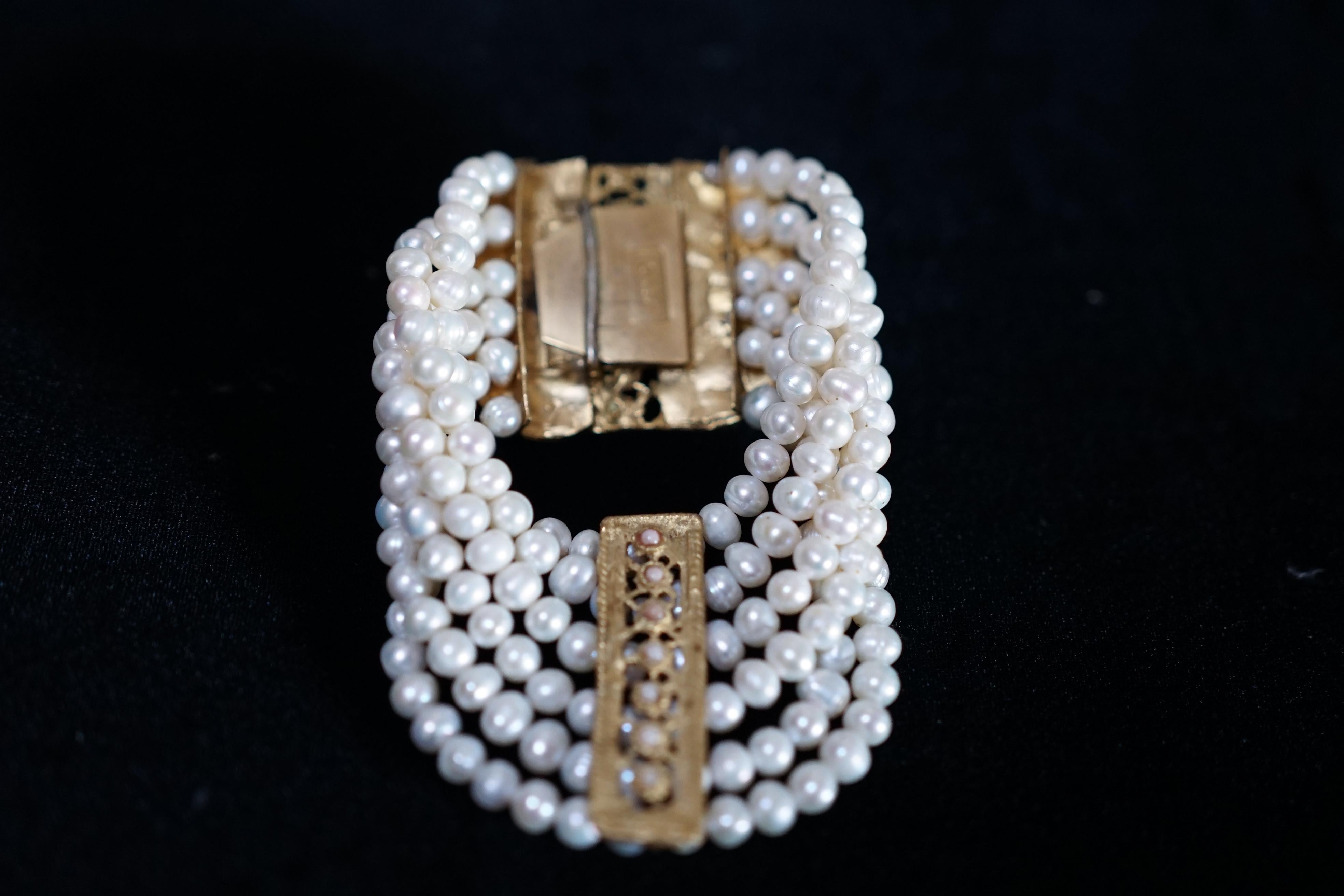 A freshwater pearl bracelet made as a custom piece for the 2000 Paramount film, Gladiator. The jeweler says it was created from freshwater pearls that measure 5 MM. The bracelet was worn by the emperor's sister in the film or the emperor himself if
