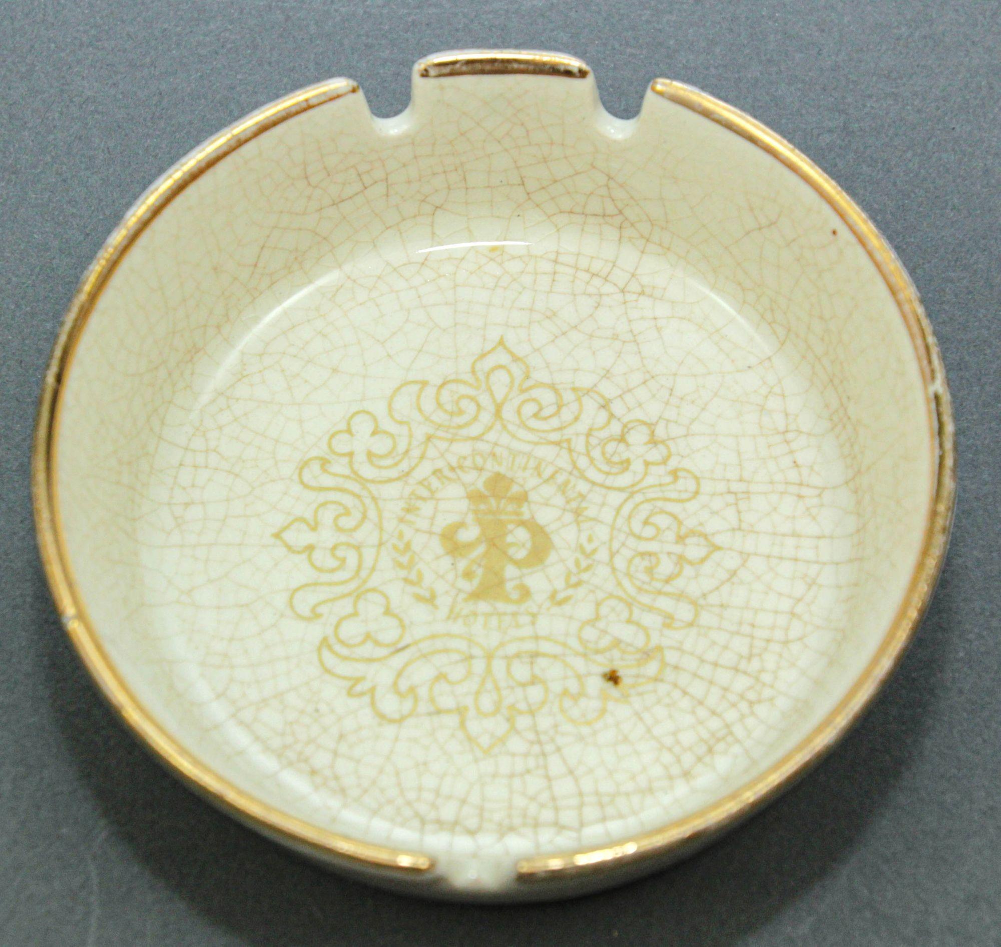 Collectible Ashtray Intercontinental Paris le Grand Hotel France.
From the InterContinental Paris le Grand Hotel France, collectible.
Ivory white ceramic with gold Imperial crown logo and inscriptions.
A cream crackled ceramic ashtray with gilt edge