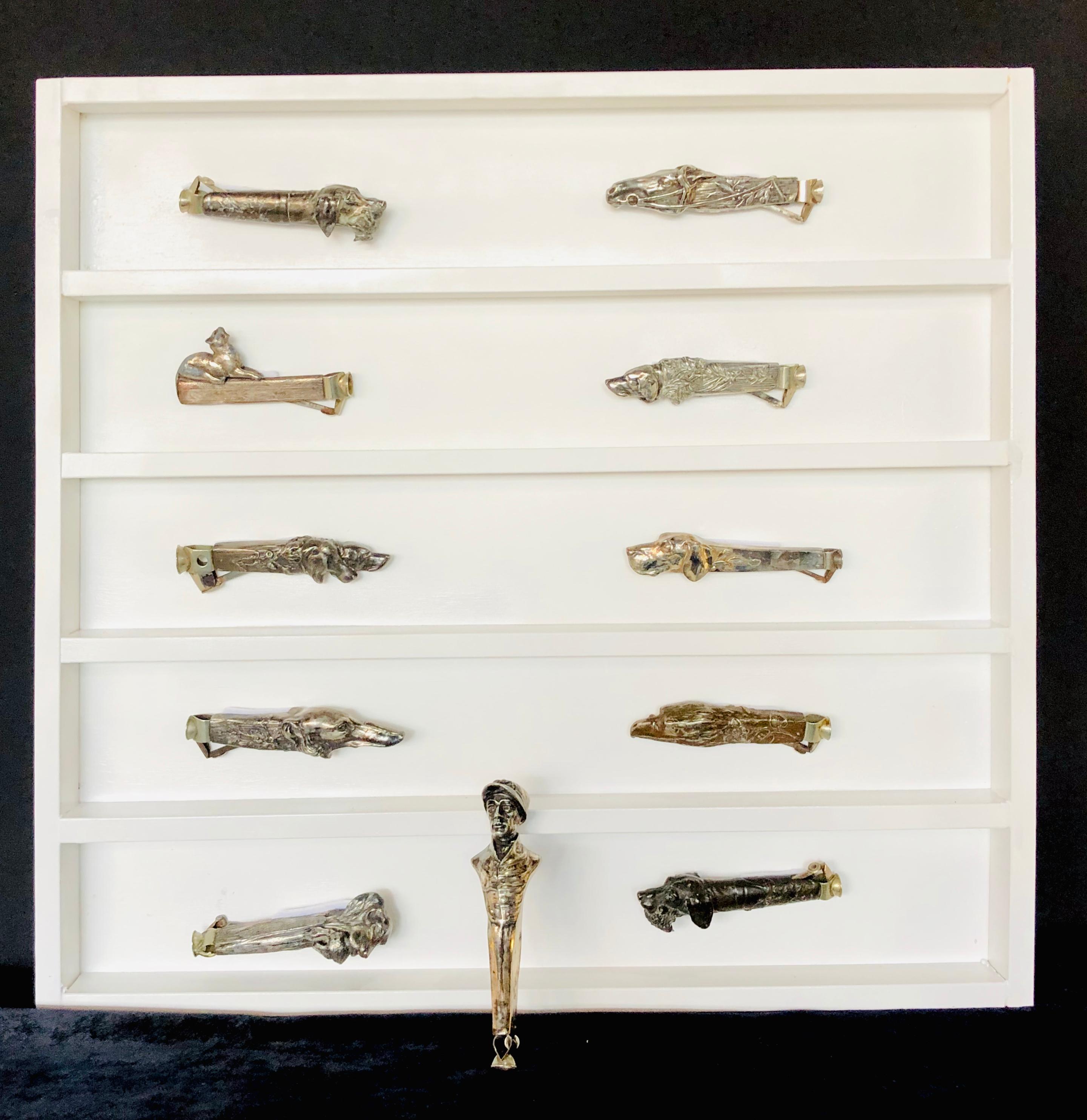 Fine Collection of 11 antique silvered metal cigar cutters including 7 dogs, jockey, horse, eagle, and a cat from The Jerry Terranova Estate. My personal favorite is the Dachshund. One of several collections Direct from the estate of the worlds most