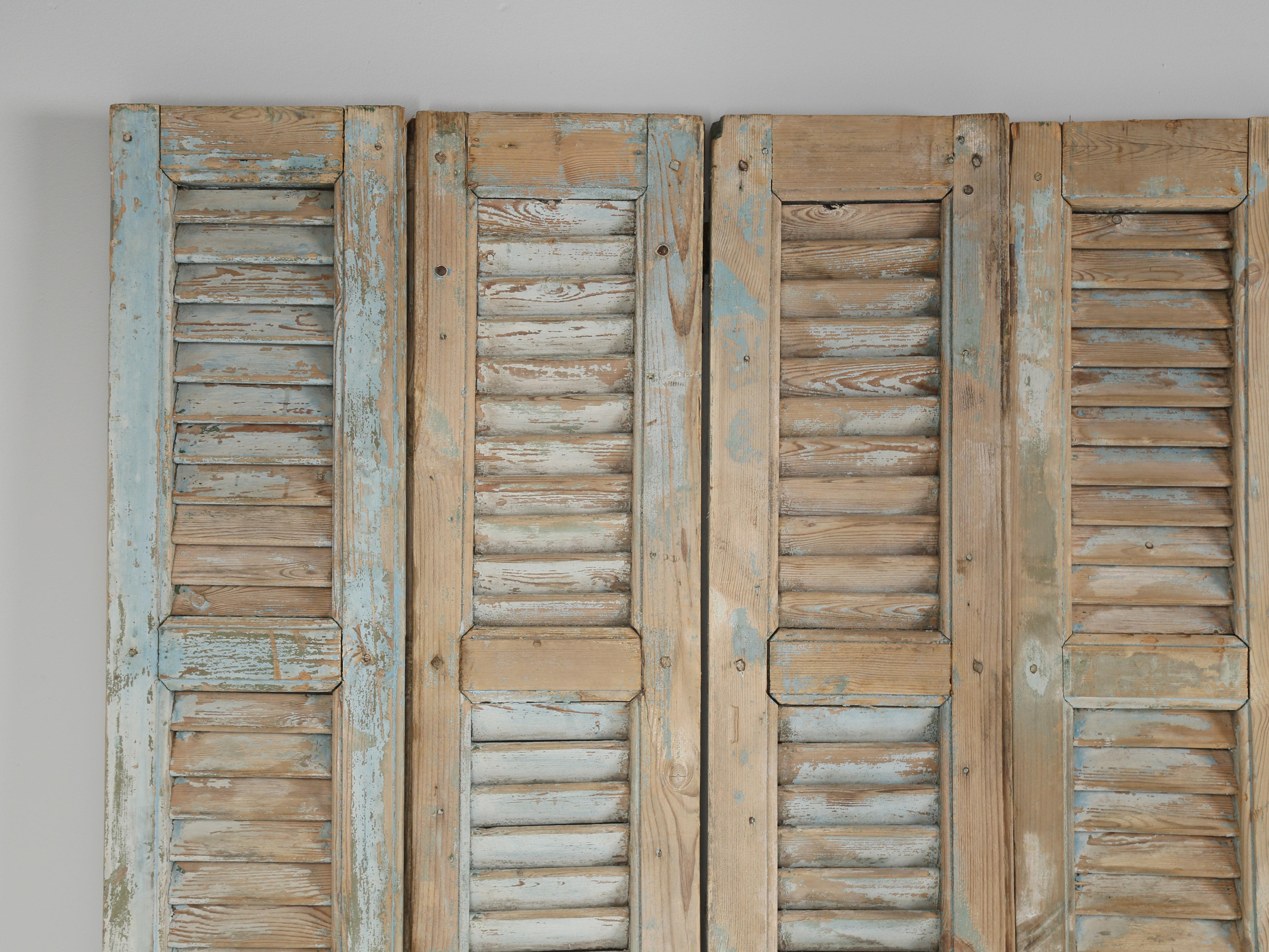 Great collection of (14) antique French shutters that could be idea for fabricating a headboard, paneling a wall or simply connecting to form a screen. The color palette of these French antique shutters is the toughest for us to locate and the most
