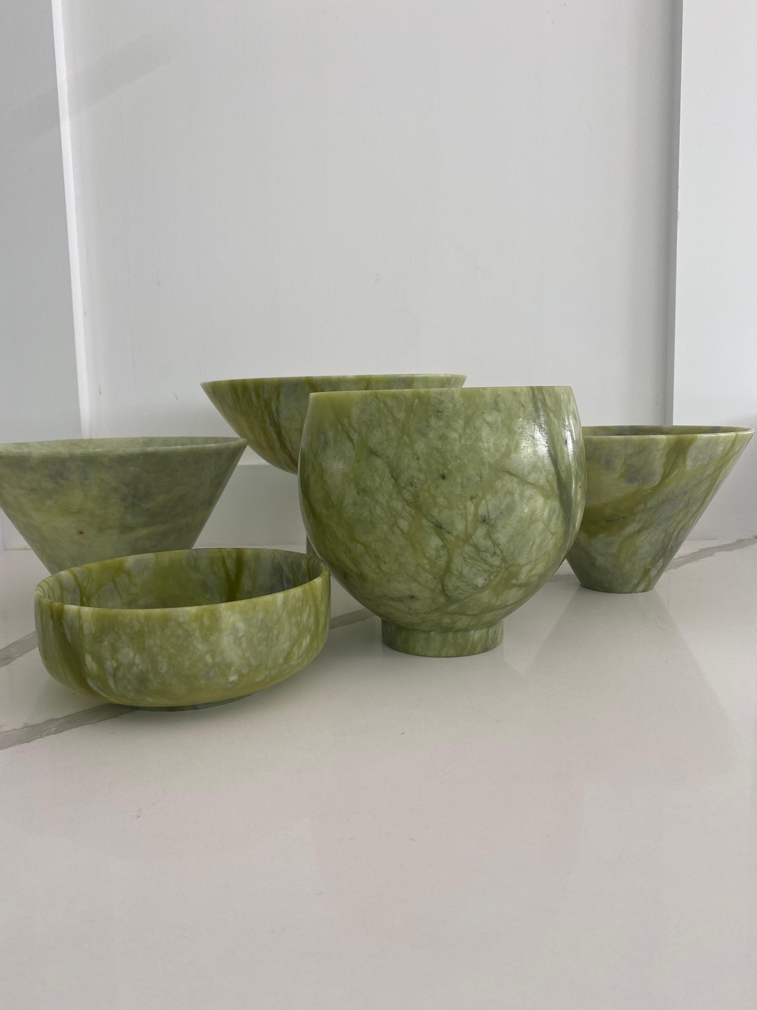 Set of five modern green veined stone bowls.
various sizes as photographed.