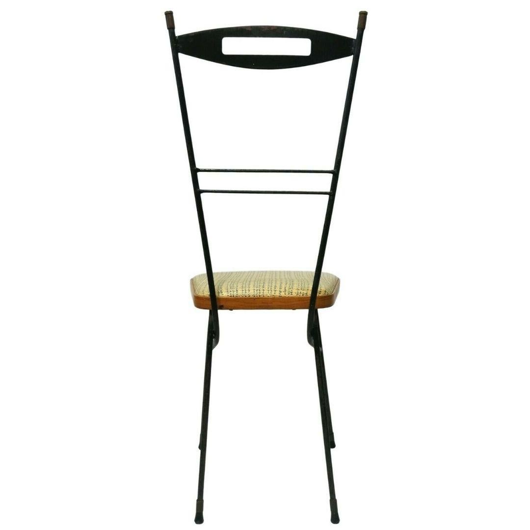 Particular original collection chair from the 1960s, made with an iron rod structure and seat with eco-leather upholstery and eco-wood finish

it was one of the first experiments in using fake wood to 