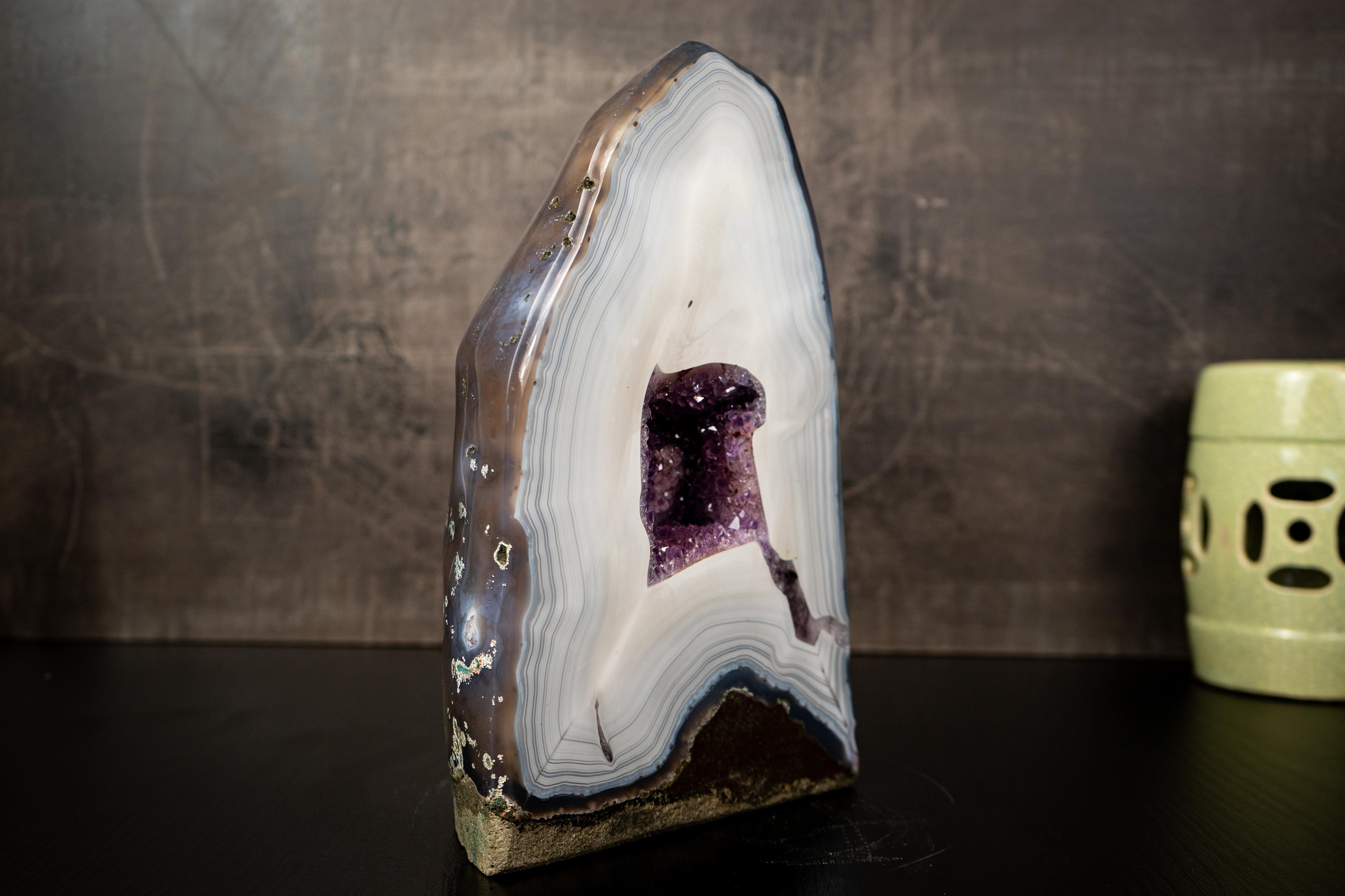 A Collector's Specimen, Perfect for a Collection with its Rare White Agate Laces and Purple Amethyst Interior

▫️ Description

Brazil ranks among the world’s leading agate producers, and once in a while, a geode of this caliber is uncovered. This