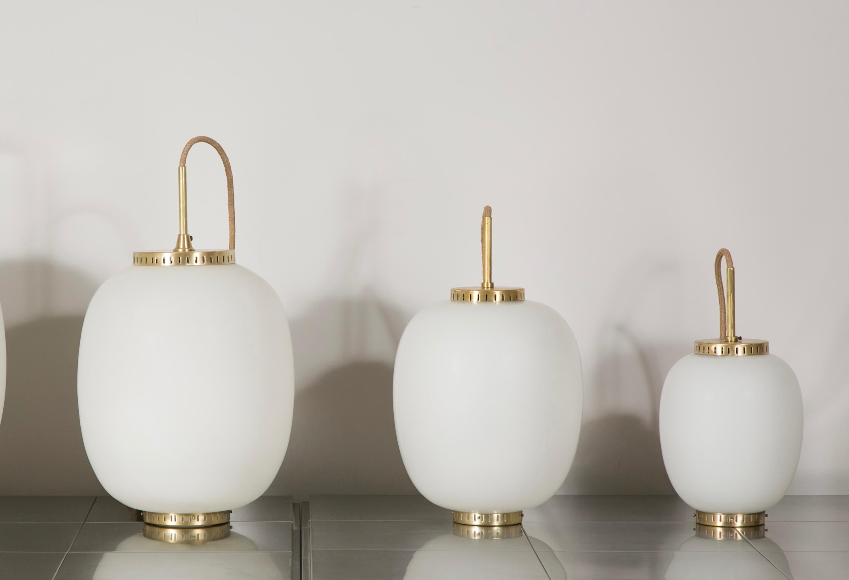 Collection of 10 opaline glass and brass ceiling fixtures.
See dimensions below
Designed by Bent Karlby for Lyfa.
Denmark, late 1950s.

Please note that this set of ceiling fixtures corresponds to the three items on the on last photo: Left (