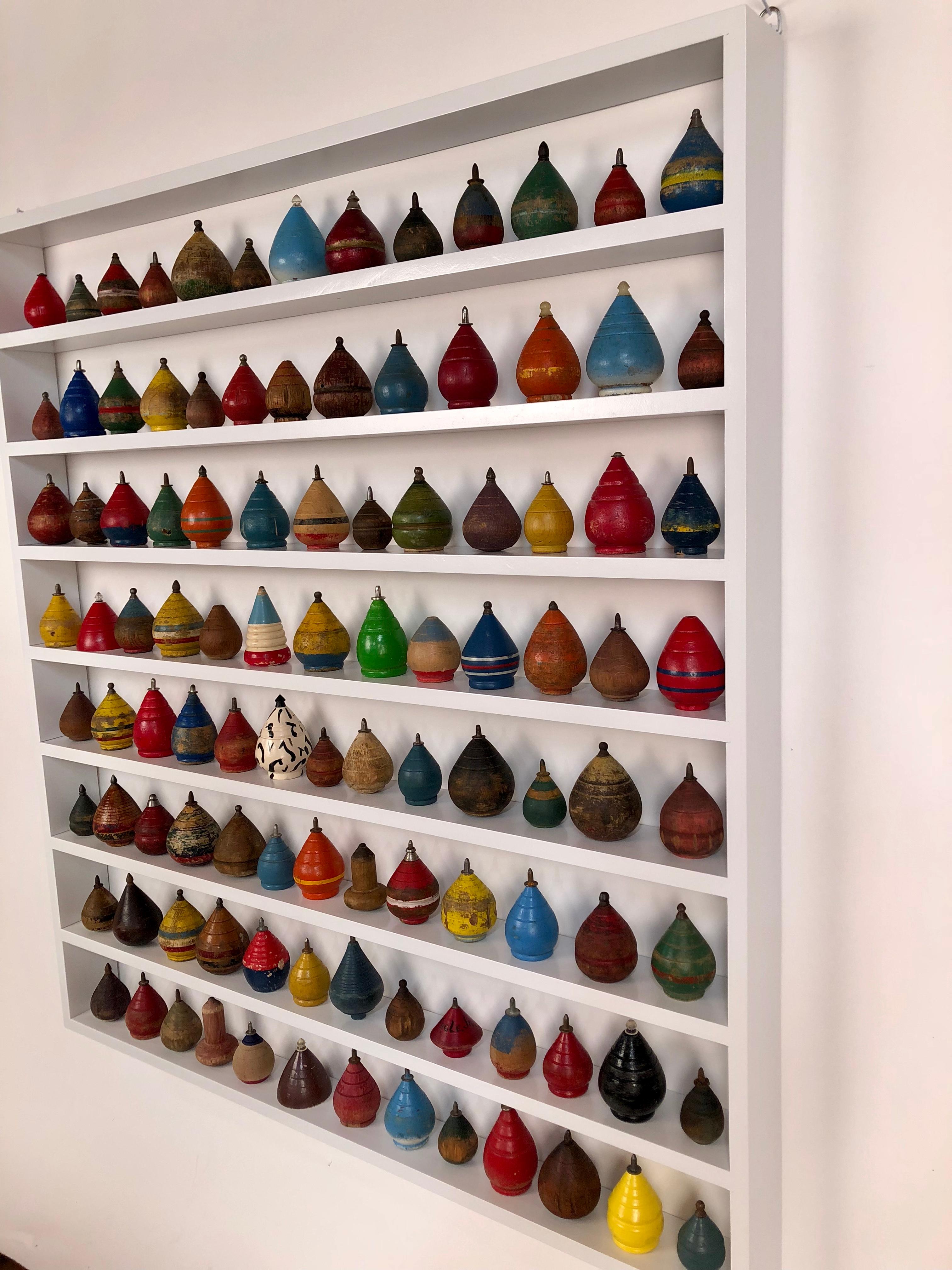 Collection of 100 Antique Spinning Tops in a Custom Shadow Box Frame 1