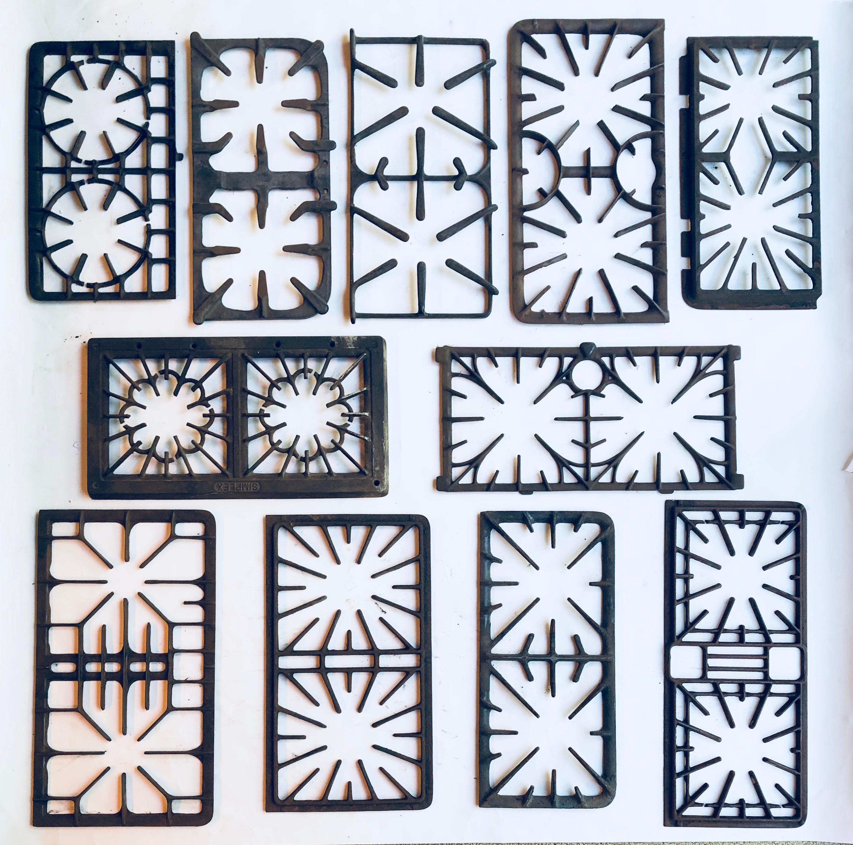 Collection of 11 rare antique cast iron stove grates, circa 1920-1950. Great for kitchen wall decoration. These measure between 16-19 inches wide and 9-10 inches height.