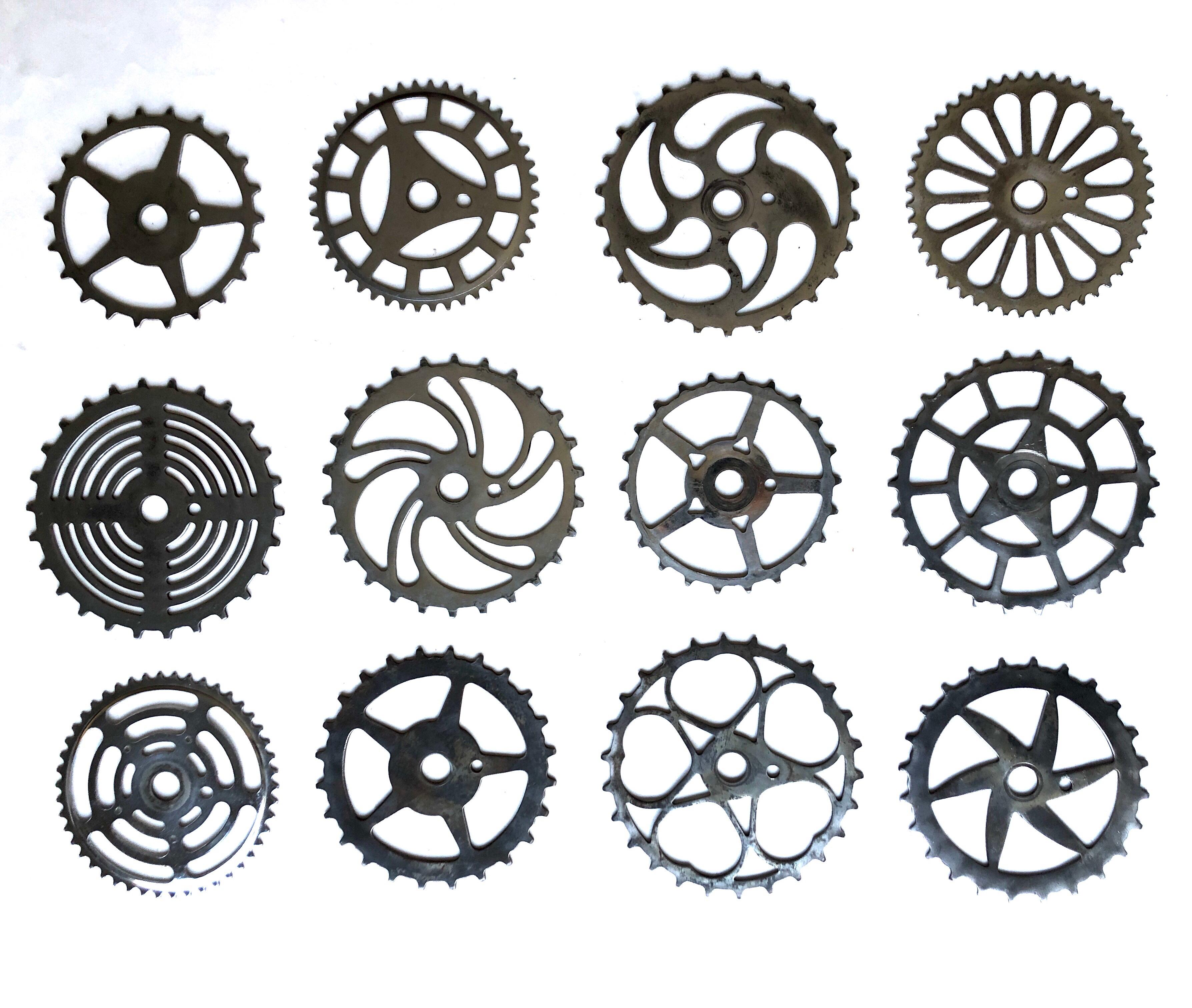 A collection of 12 antique and vintage bicycle sprockets dating from the 1930's to the 1960's. These are chrome plated and polished steel with surface patina. Wonderful graphic display with dozens of ways to display them. The smallest measures 7