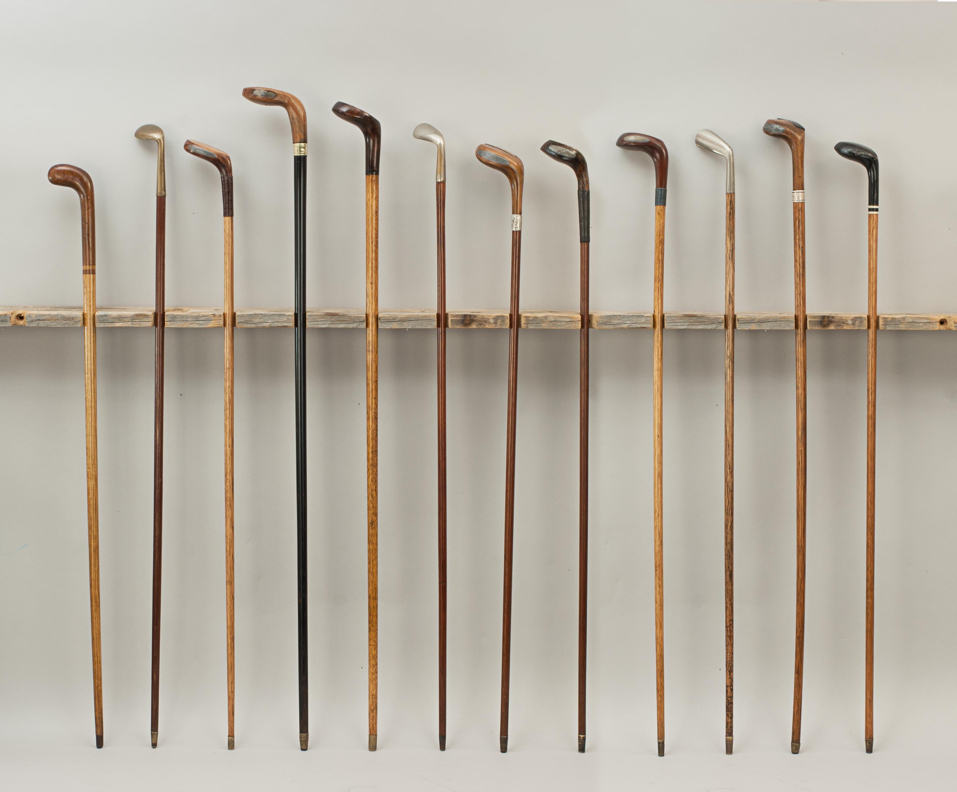 Twelve antique golf club walking sticks, Sunday Clubs.
A desirable collection of walking canes with the handles fashioned in the shape of a golf club heads. Nine of the walking stick heads are made of wood, three are made of metal and all are with