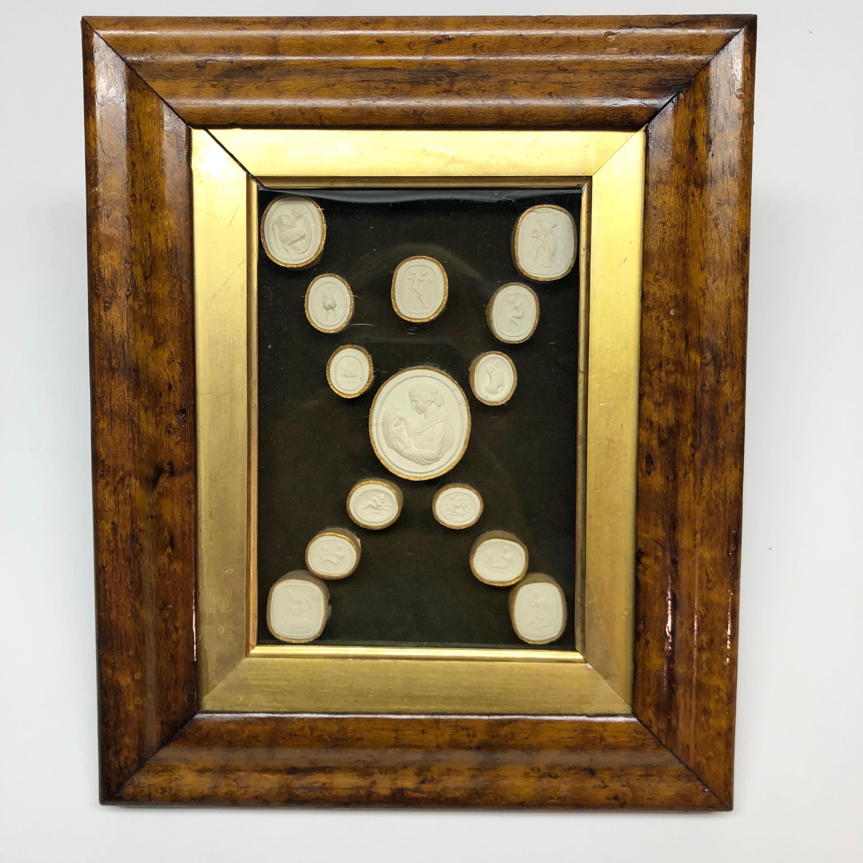 Collection of 14 Grand Tour intaglios in original fruitwood frame.