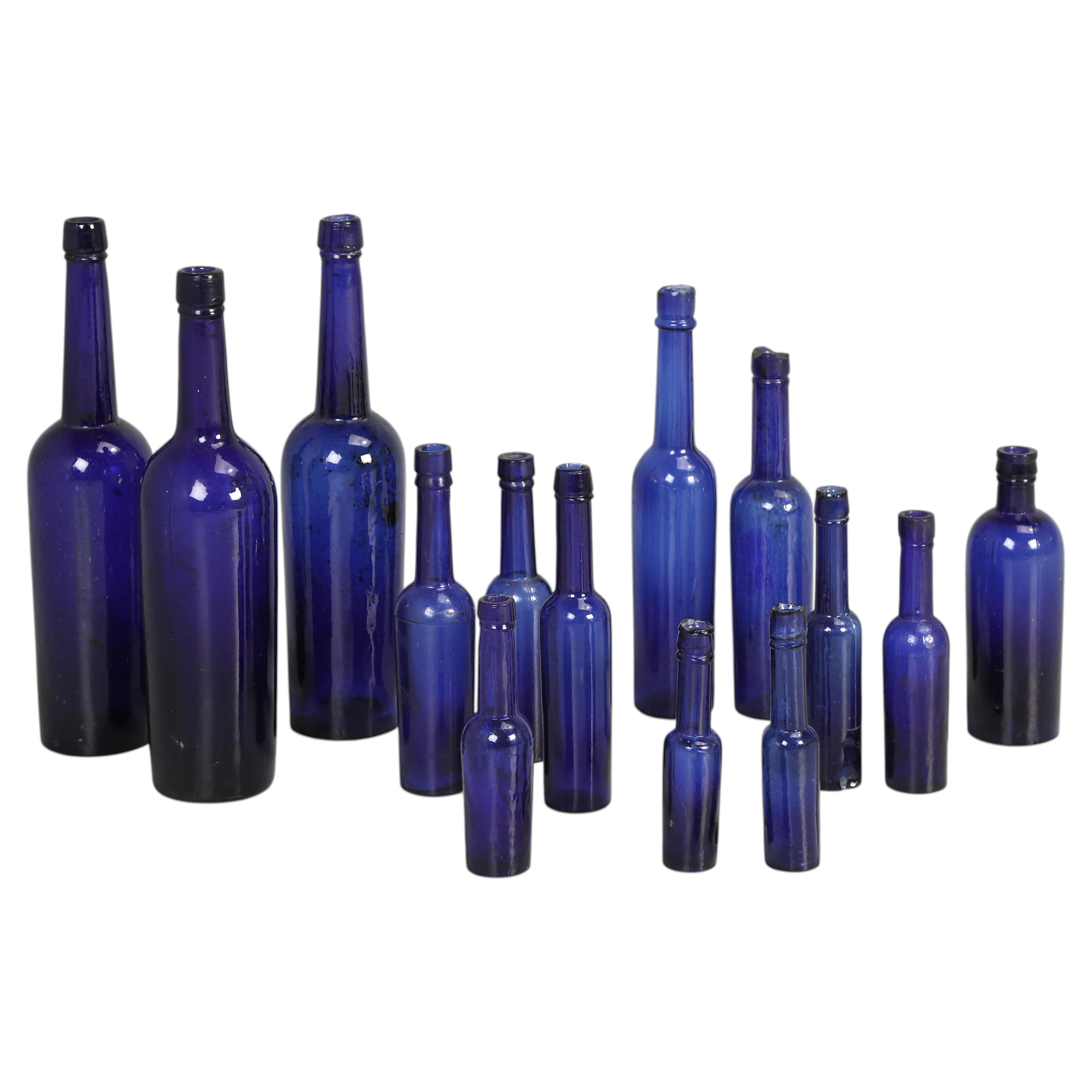 Collection of '14' Cobalt Blue caster Oil Hand Blown Bottles Made in 1800s