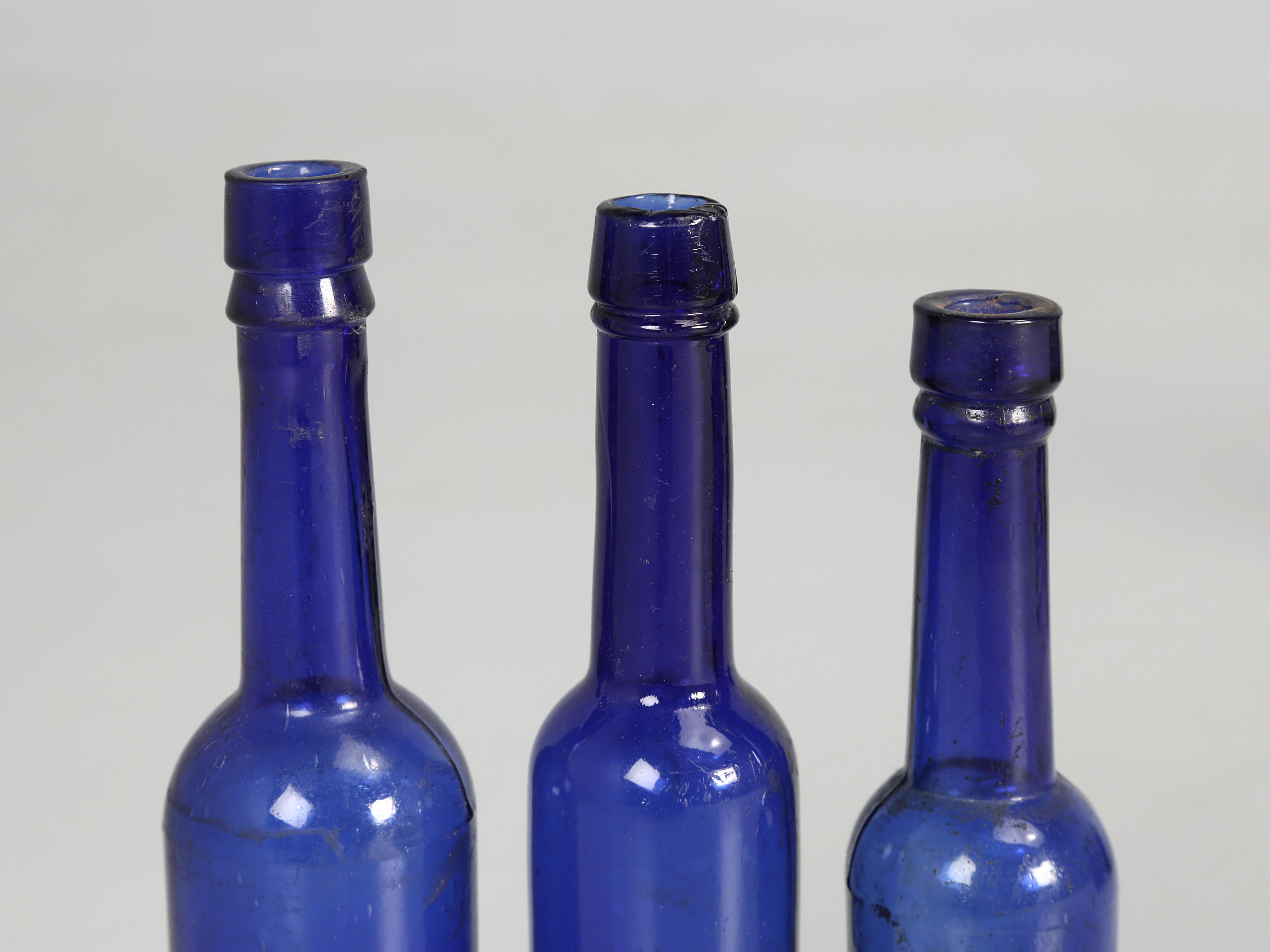 Late 19th Century Collection of '15' Cobalt Blue caster Oil Hand Blown Bottles Made in 1800s For Sale