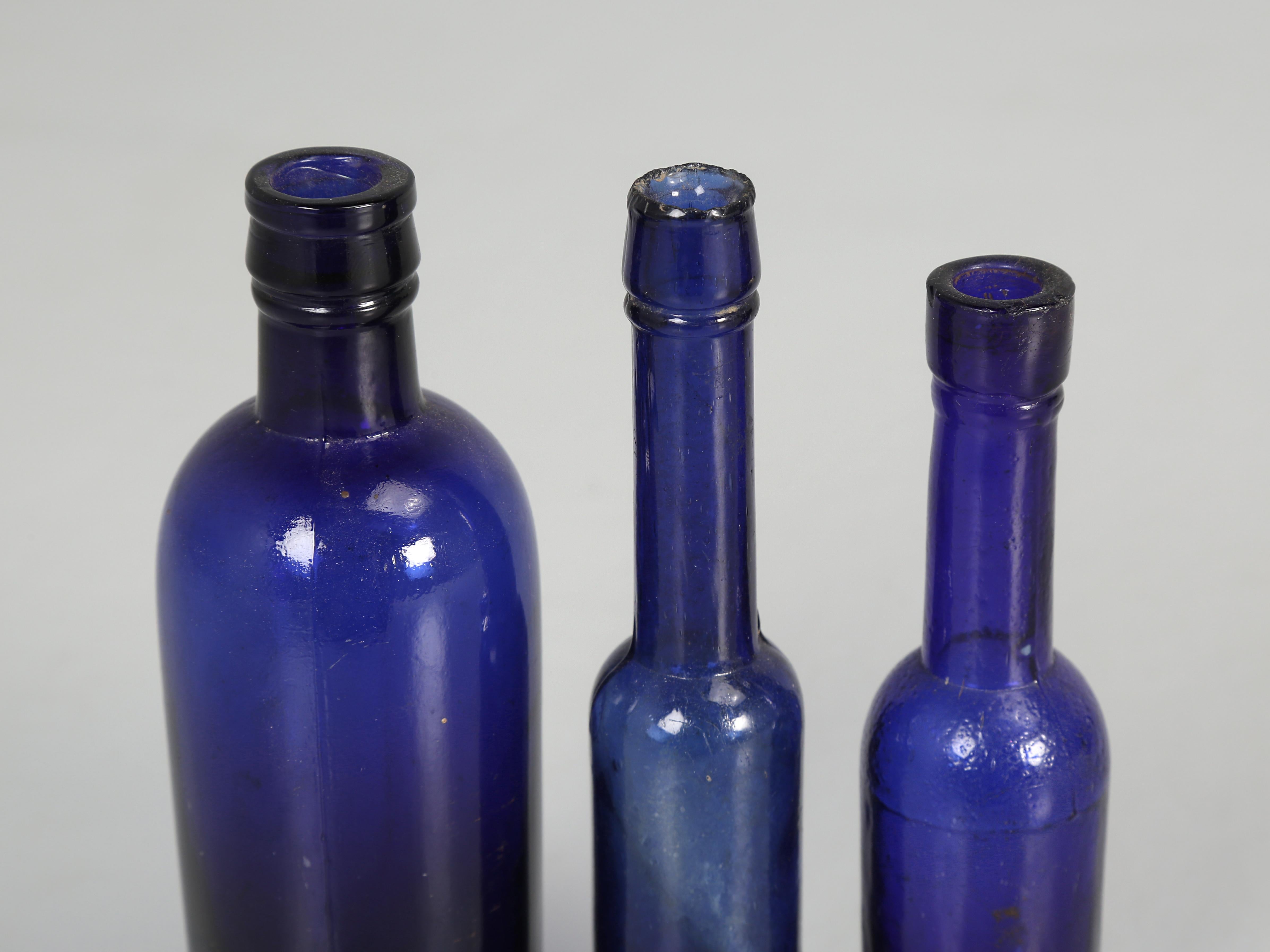 Collection of '15' Cobalt Blue caster Oil Hand Blown Bottles Made in 1800s For Sale 2