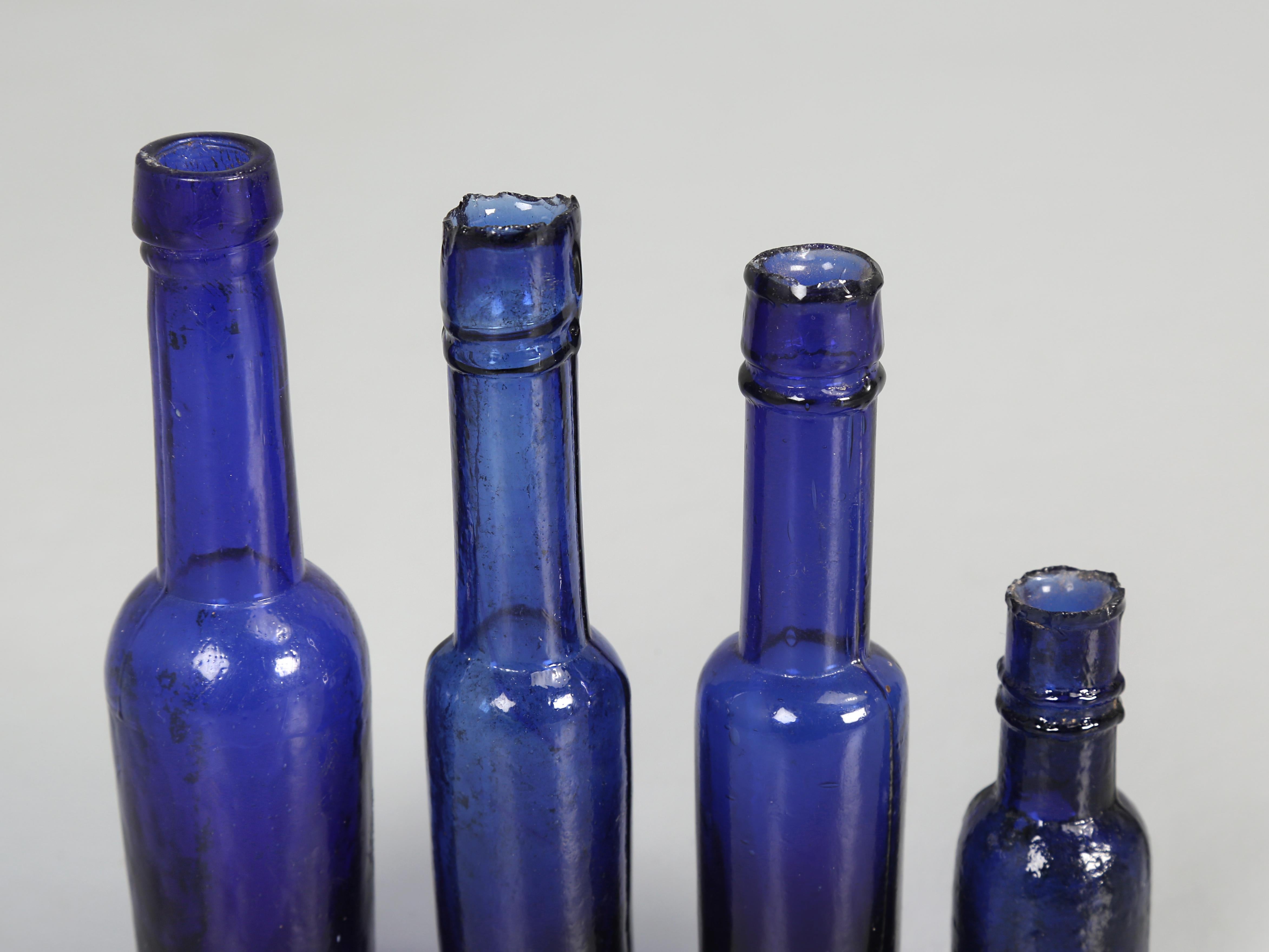Collection of '15' Cobalt Blue caster Oil Hand Blown Bottles Made in 1800s For Sale 5