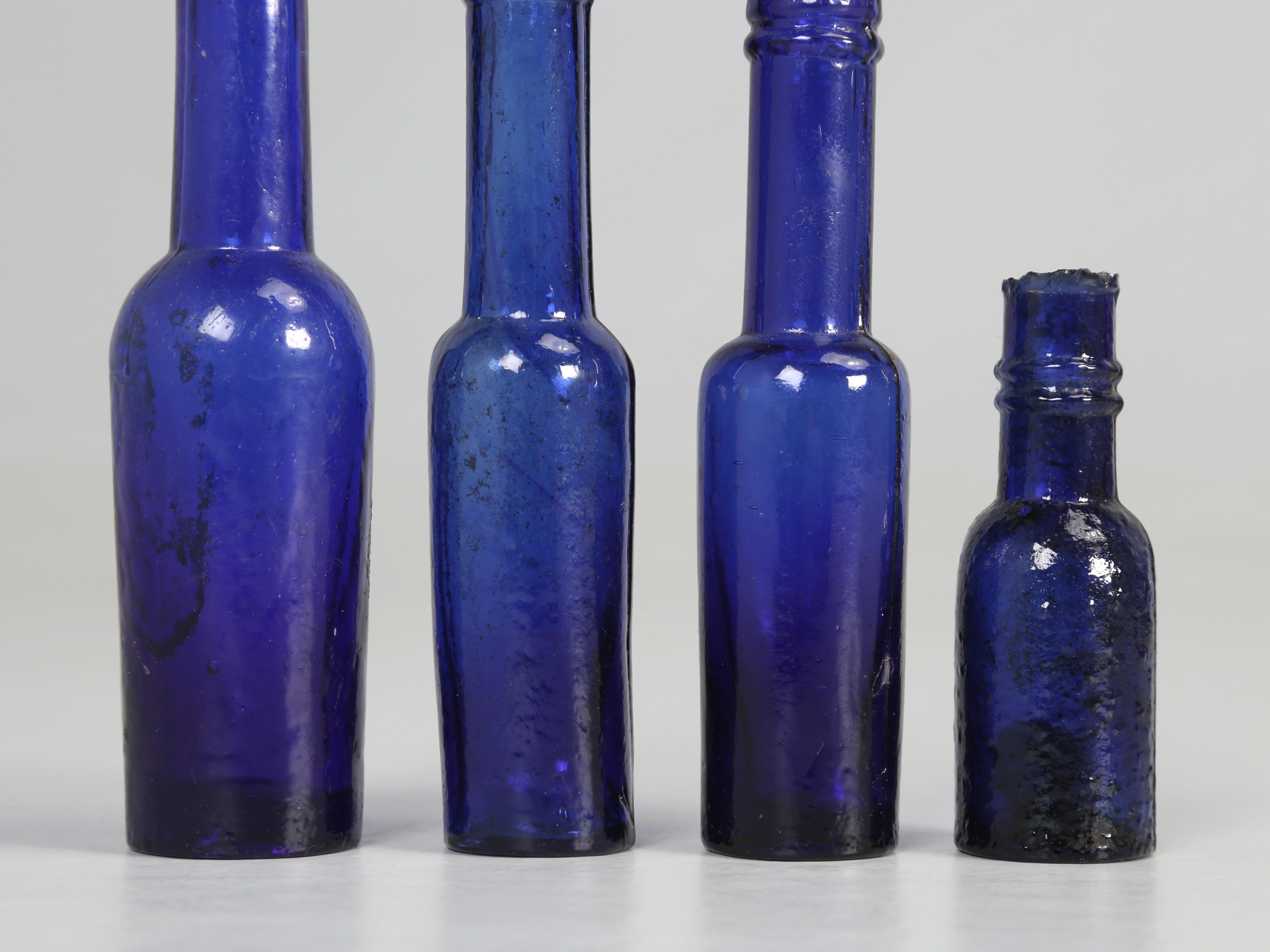 Collection of '15' Cobalt Blue caster Oil Hand Blown Bottles Made in 1800s For Sale 6