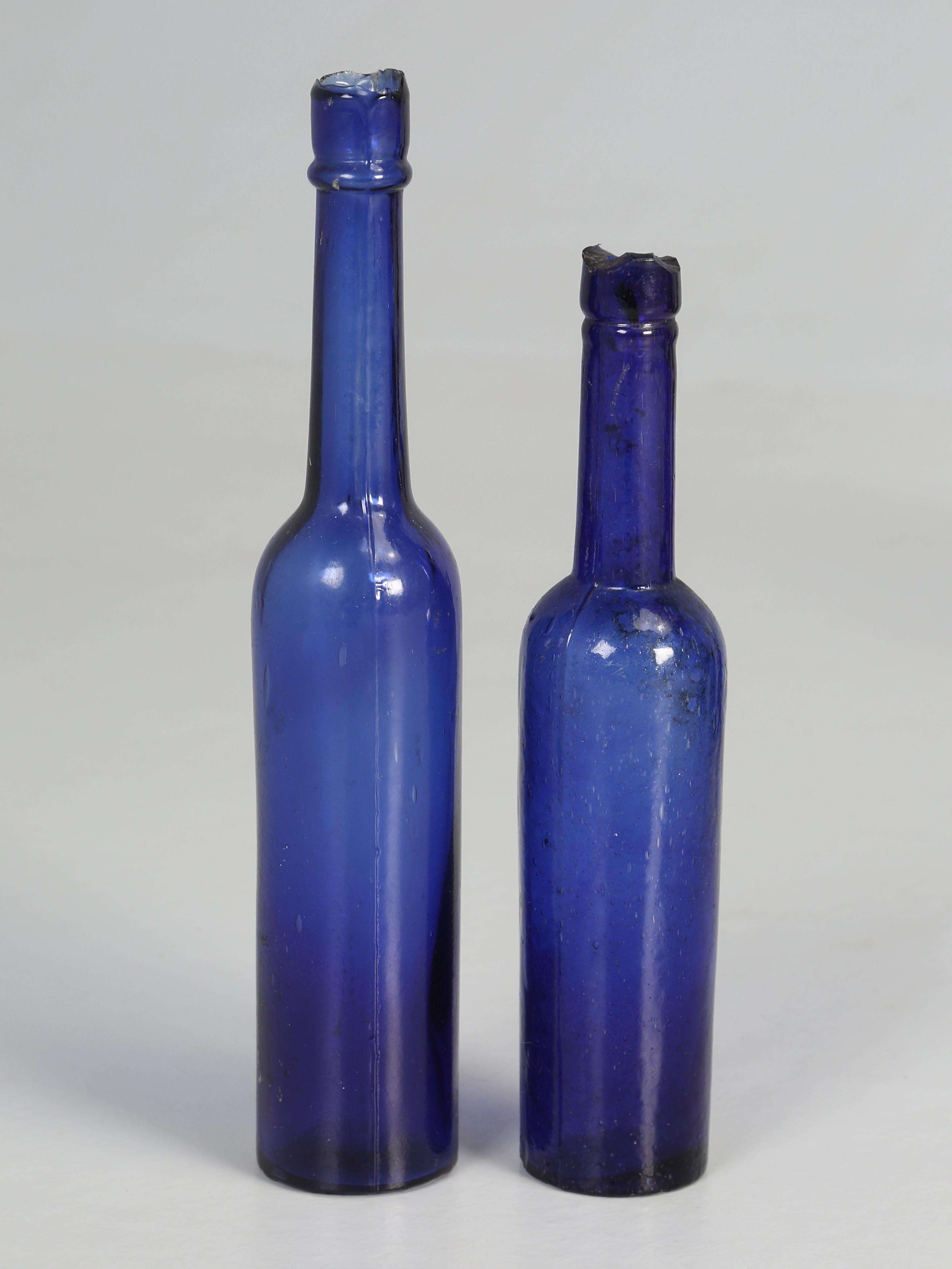 Country Collection of '15' Cobalt Blue caster Oil Hand Blown Bottles Made in 1800s For Sale
