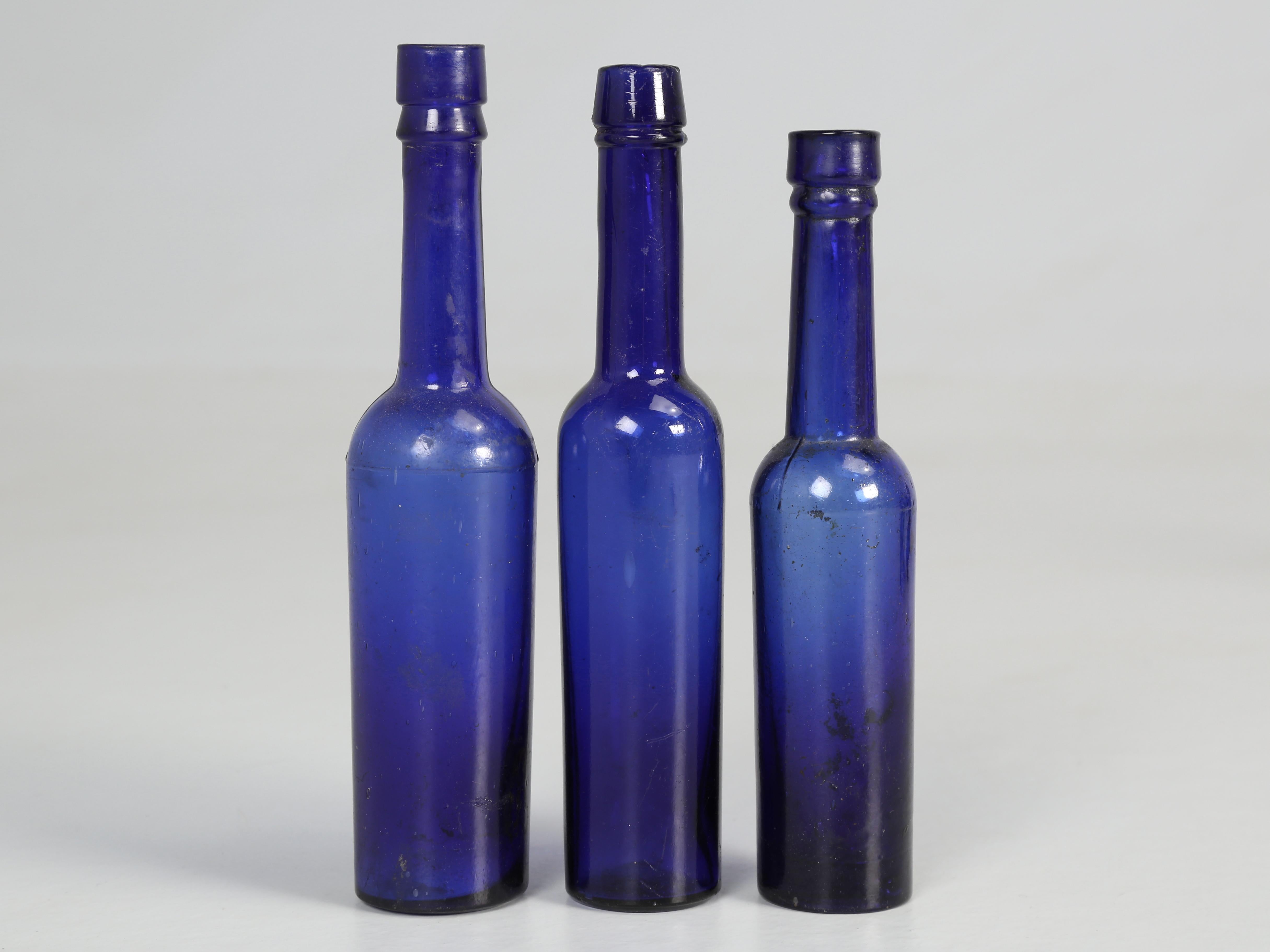 Collection of '15' Cobalt Blue caster Oil Hand Blown Bottles Made in 1800s In Good Condition For Sale In Chicago, IL