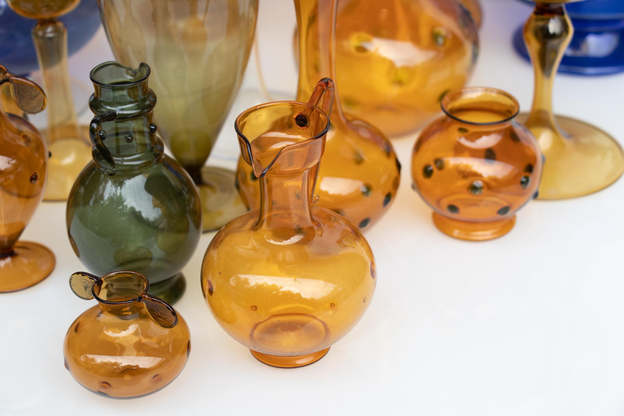 Vintage collection of 18 decorative vases, light as a feather and very detailed made either by Bimini (Austria) or one of the factories from the town Lauscha, Germany. 
 
Bimini Glass was founded in Austria in 1923 by Fritz Lampl. The company