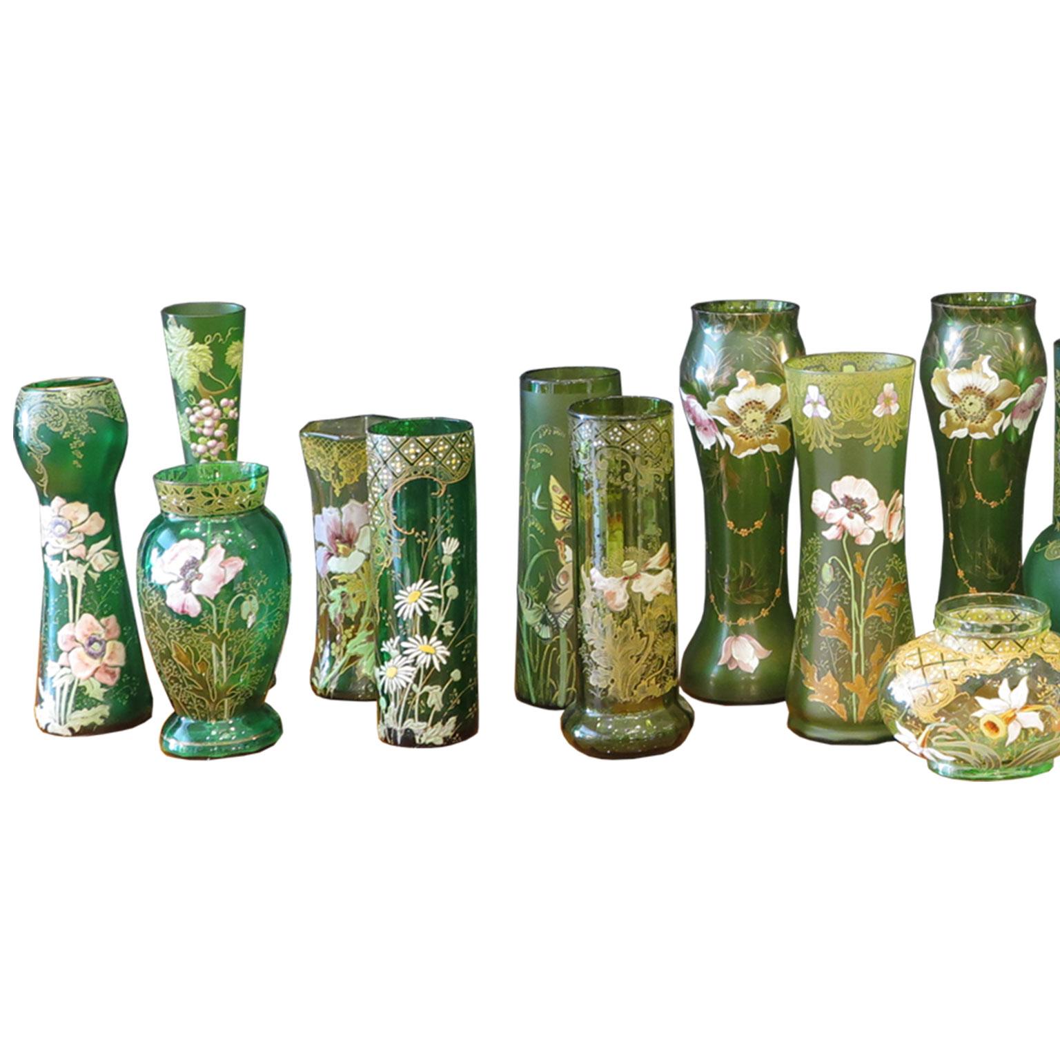 Collection of 18 glass vases in different green tones with polychrome enamel decor in floral motifs. Assortment of different sizes, green tones, and florals.