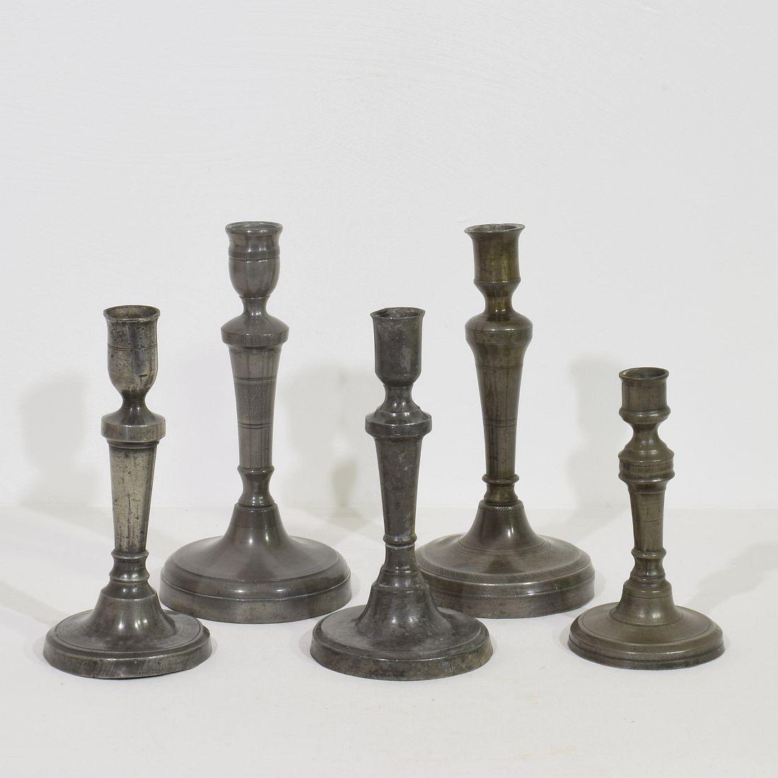 Amazing collection of five pewter candlesticks. They are all different and unique,
France, circa 1750-1850.
Weathered, dented and small losses but these imperfections help authenticate these items as they were utilitarian type pieces
Measures: H: