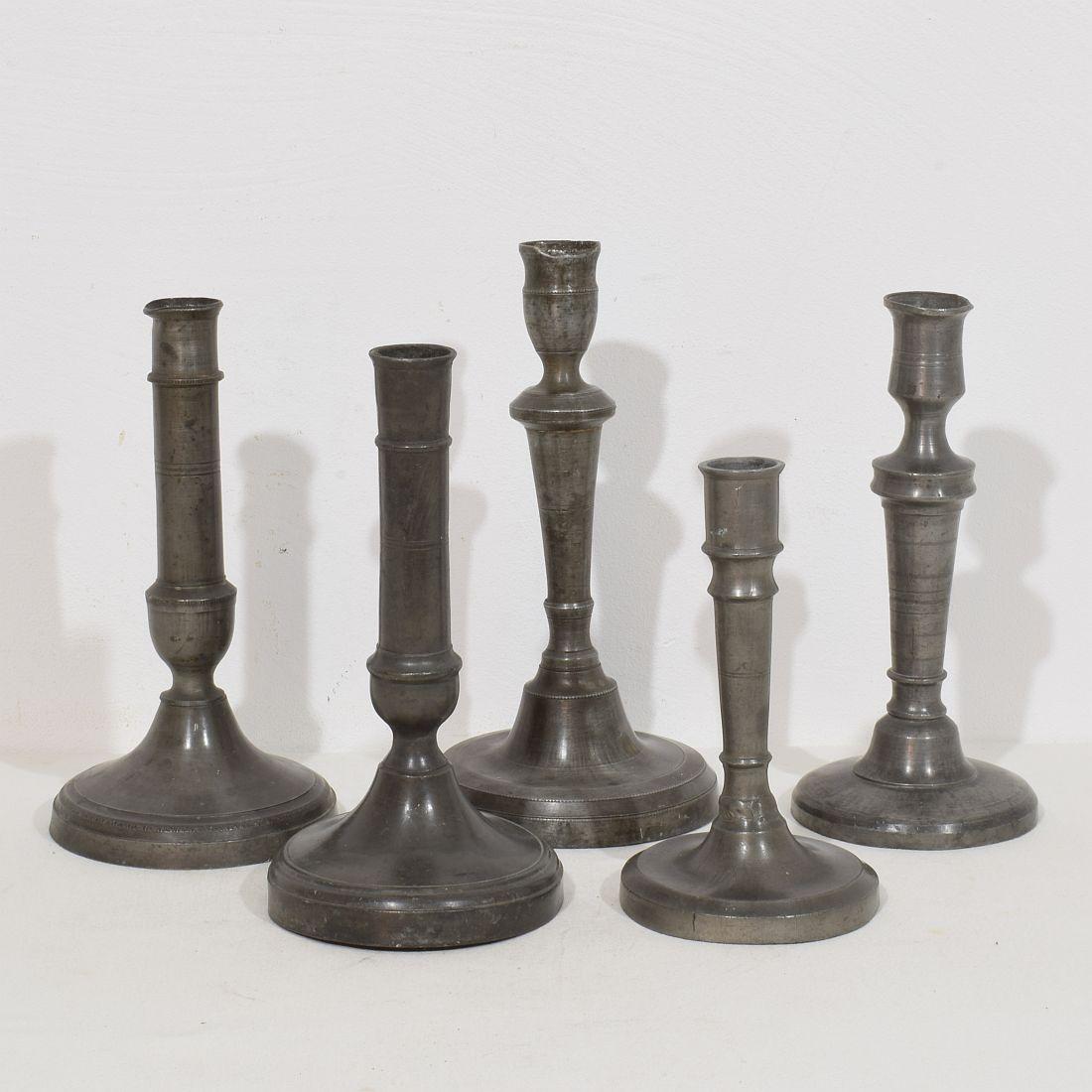 Amazing collection of five pewter candlesticks. They are all different and unique,
France, circa 1750-1850.
Weathered, dented and small losses but these imperfections help authenticate these items as they were utilitarian type pieces
H:18-25cm 