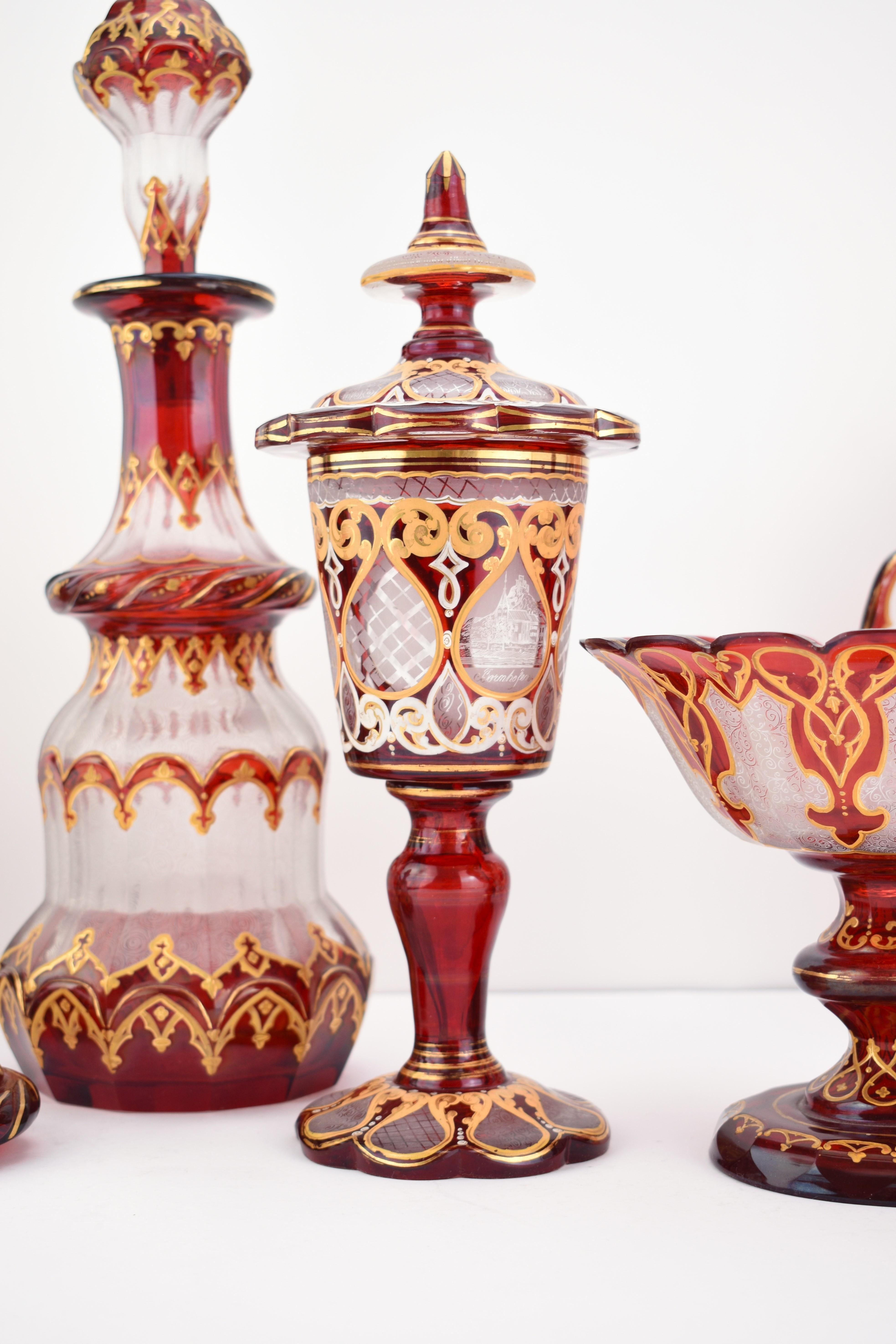 Museum Collection of Antique Ruby Red Bohemian Overlay Glass – Mid-19th Century
Bohemia, c. 1850

This elegant 7-piece museum collection showcases the finest examples of mid-19th century Bohemian ruby red overlay glass. The set includes:

One large