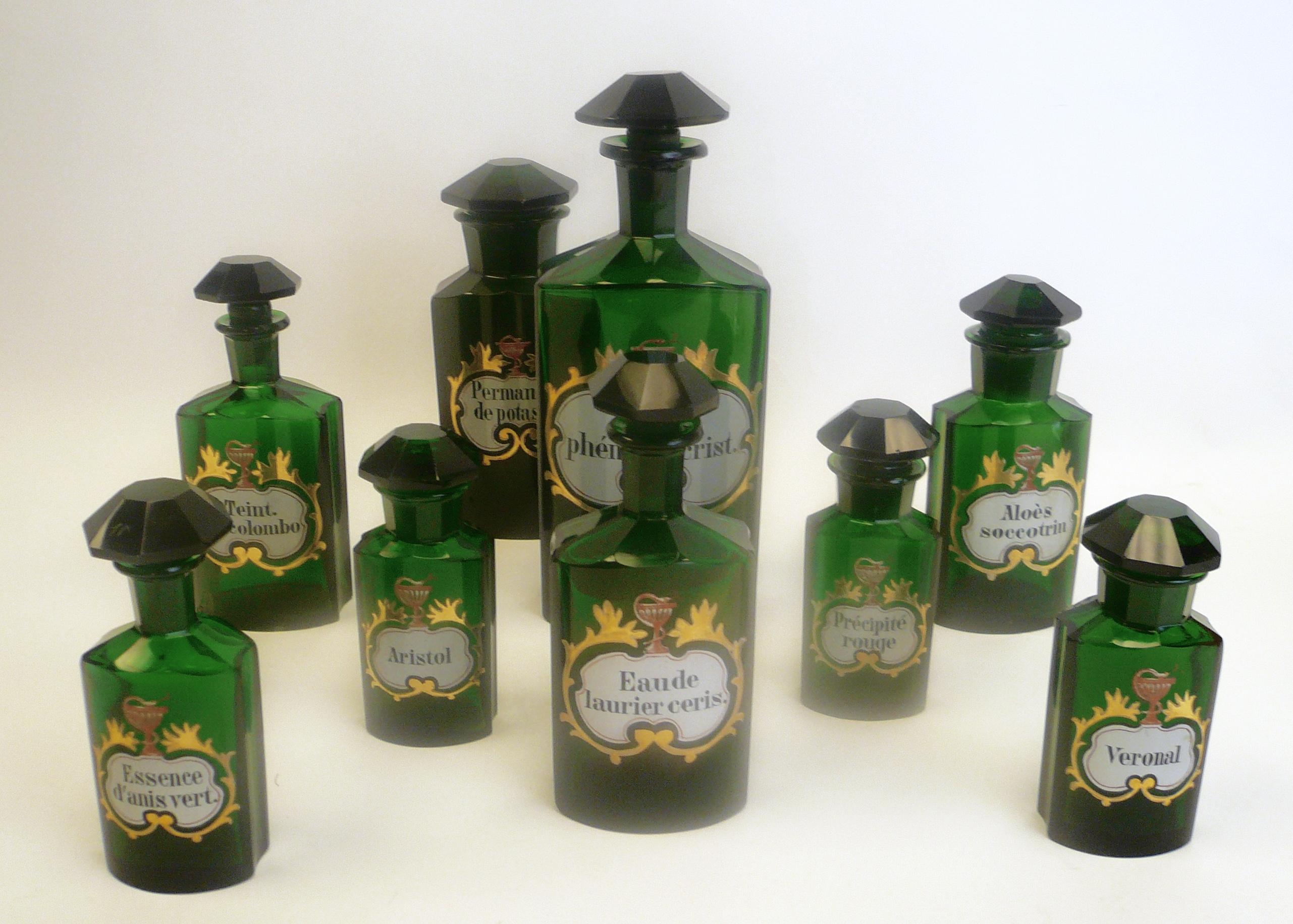 English Collection of 19th Century Green Cut Glass Apothecary Bottles