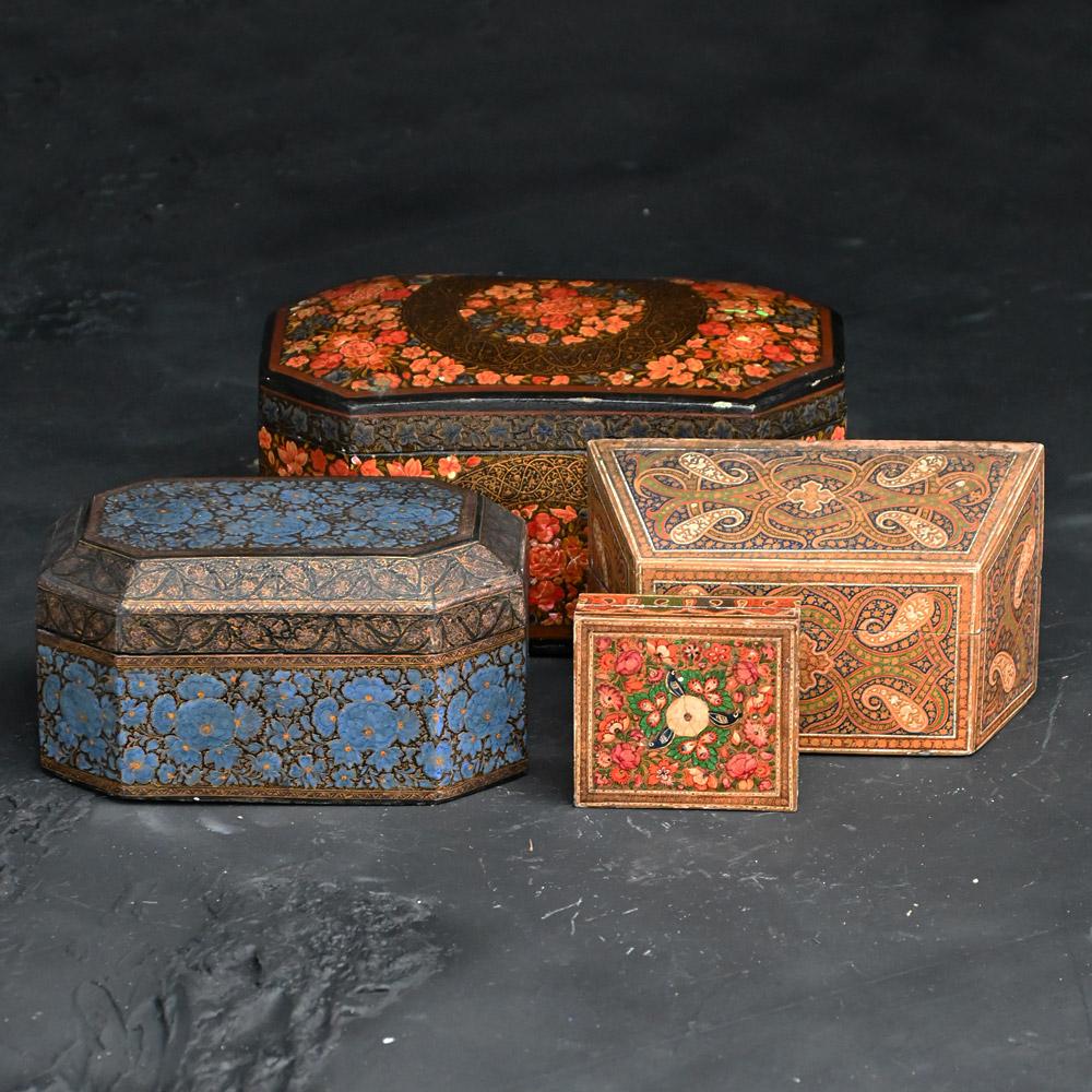 Collection of 19th Century Hand Painted Kashmiri Boxes 

A highly decorative collection of four hand painted 19th century Kashmiri boxes. Of various shapes, designs and sizes, in overall presentable condition with aged wear and tear as you may come