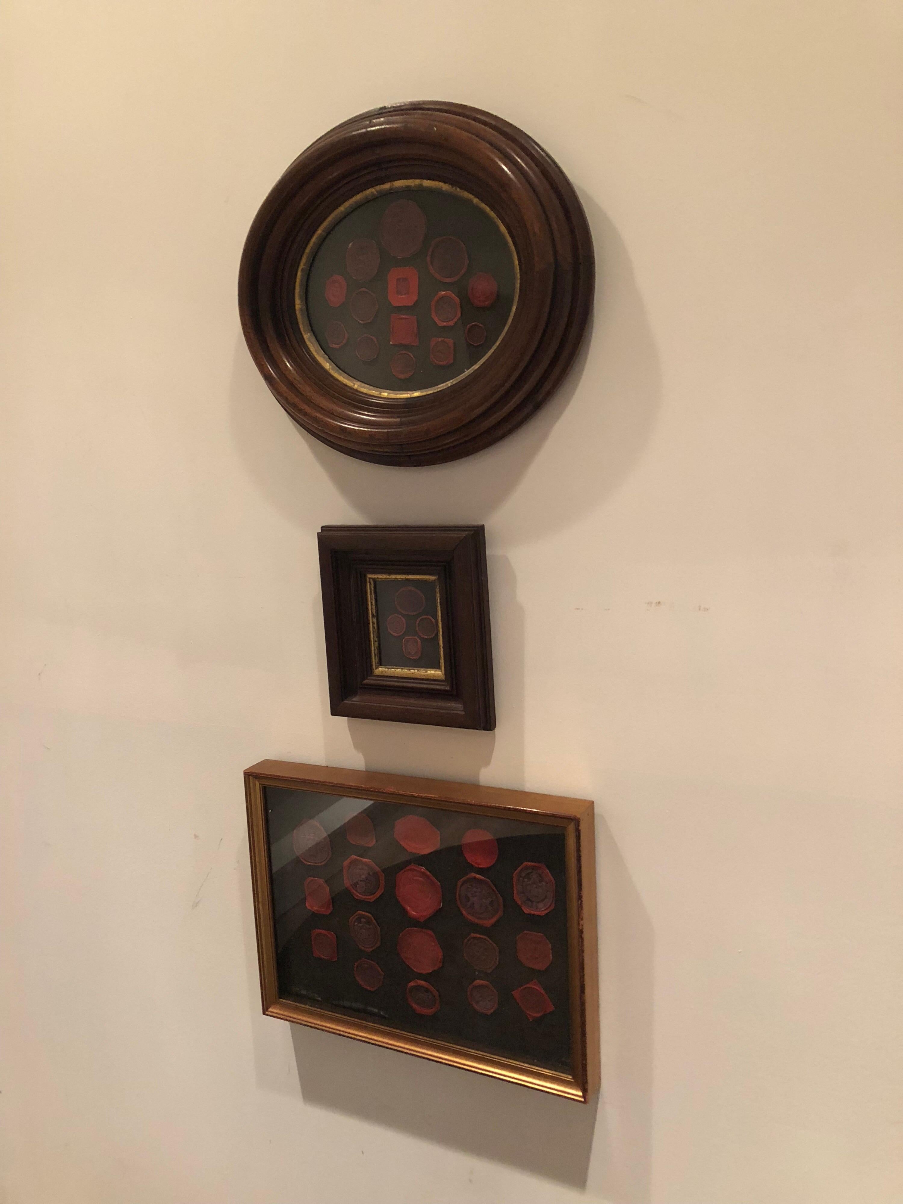 A collection of early 19th century wax seals framed.
Small frame measures 7.5