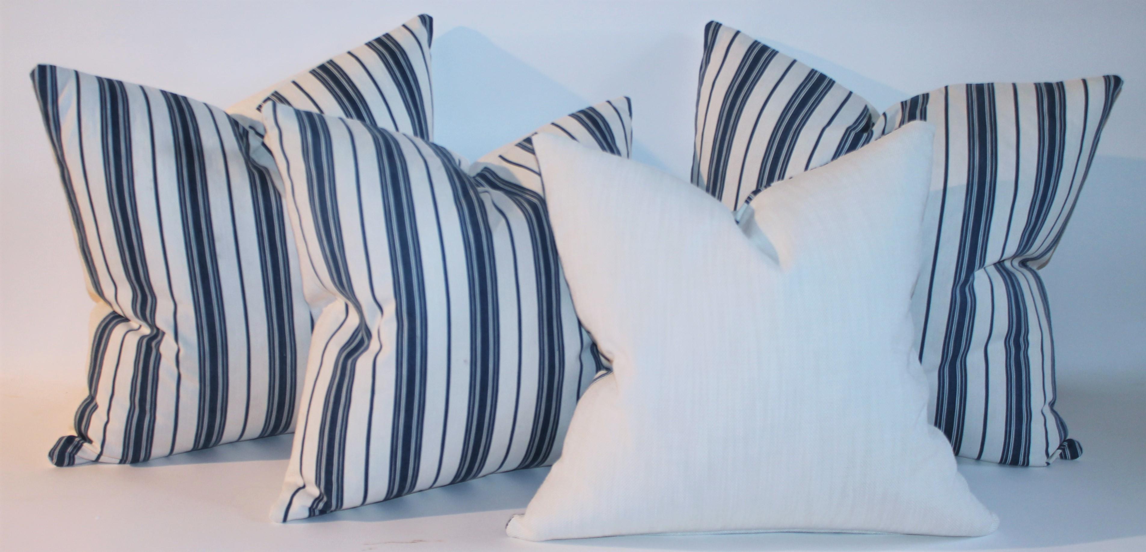 19thc blue & white ticking pillows with white linen backing. There are two pairs 20 x 20 and 22x22.

Pair of 22 x 22 
pair of 20 x 20.