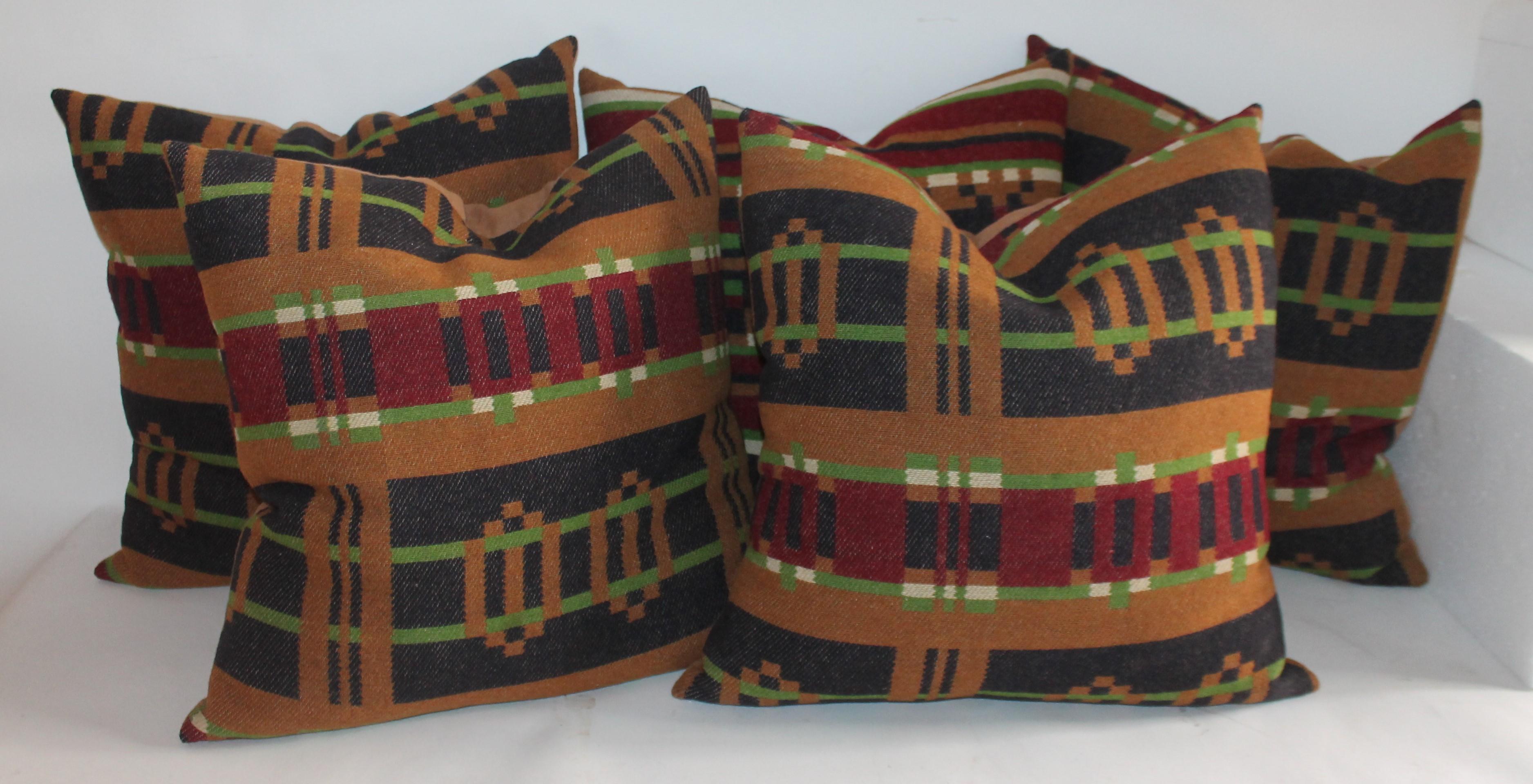 These fine 19th century horse blanket pillows are in fine condition and all have tobacco colored cotton linen backings. There are a total of five pillows in this collection. Fantastic colors and condition.