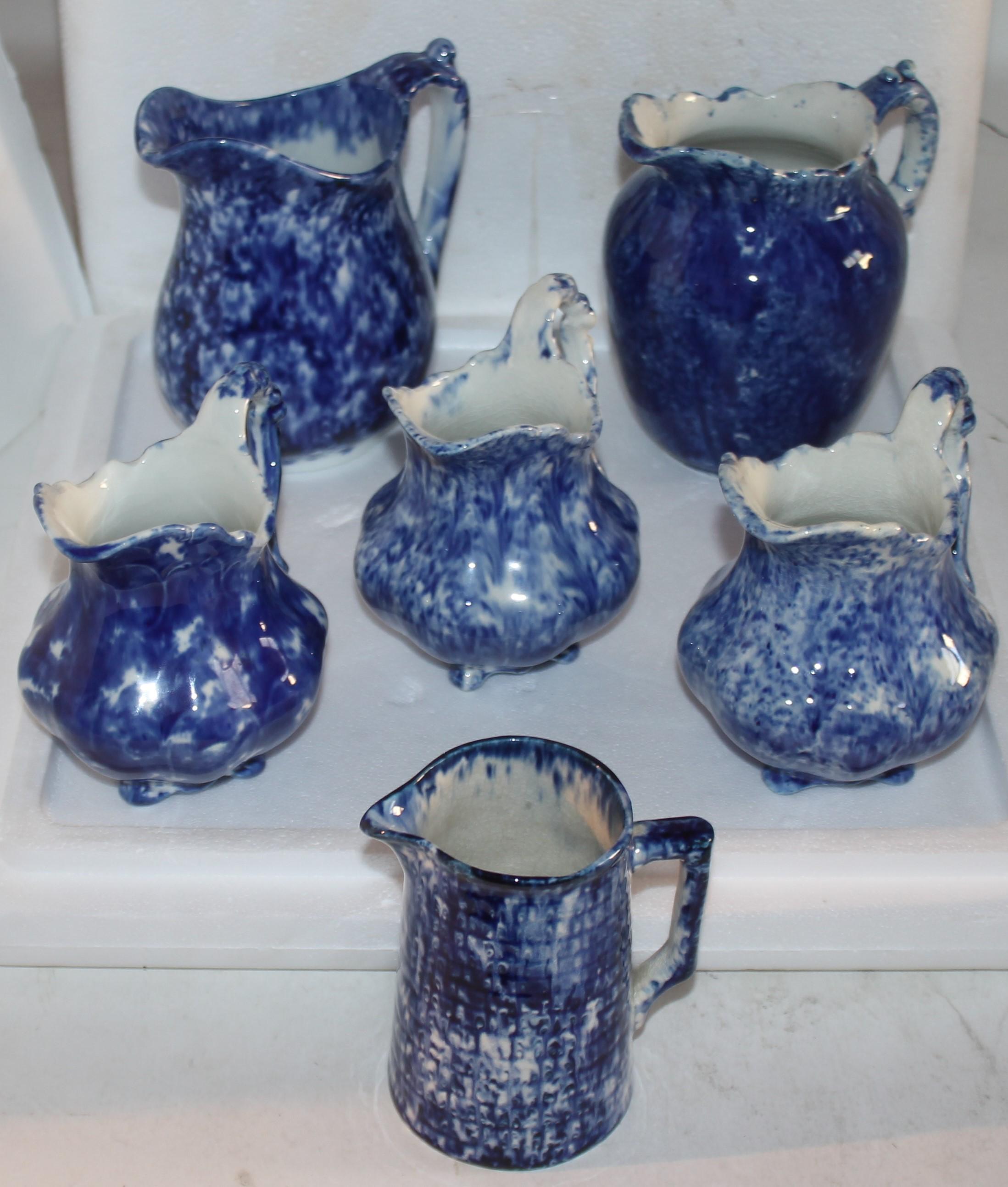 19thc sponge ware collection of six pieces of sponge ware cream or milk pitchers.
All in good condition.
Orate pitchers - 4.5 x 4.5 x4.5
Slender pitcher 4 deep x 4.5 tall x 2.5 wide
Large ornate 5.5 tall x deep x 3 wide
large creamer 5.75 W x